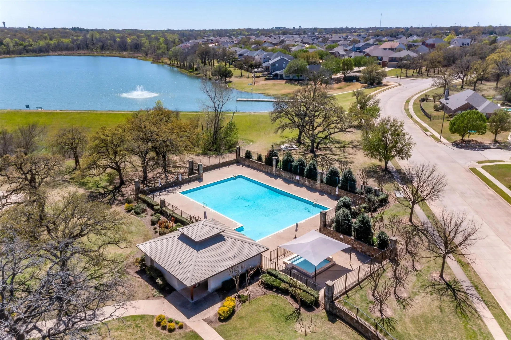 Aerial view of a nearby body of water and a pool