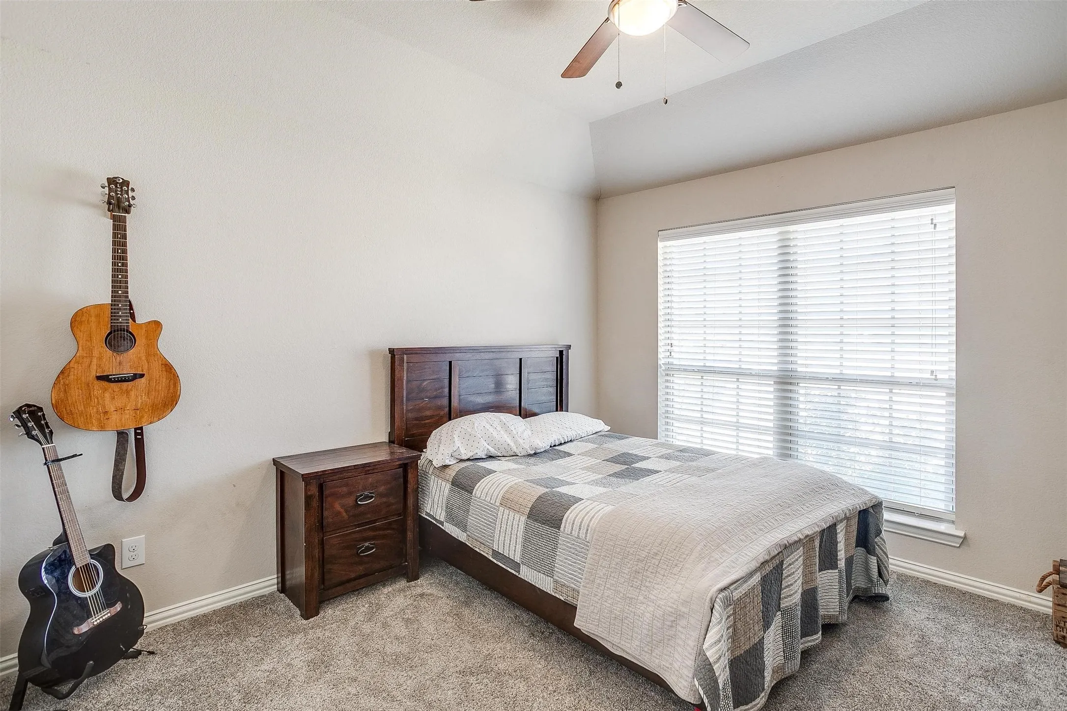 Bedroom with carpet, lofted ceiling, and ceiling fan