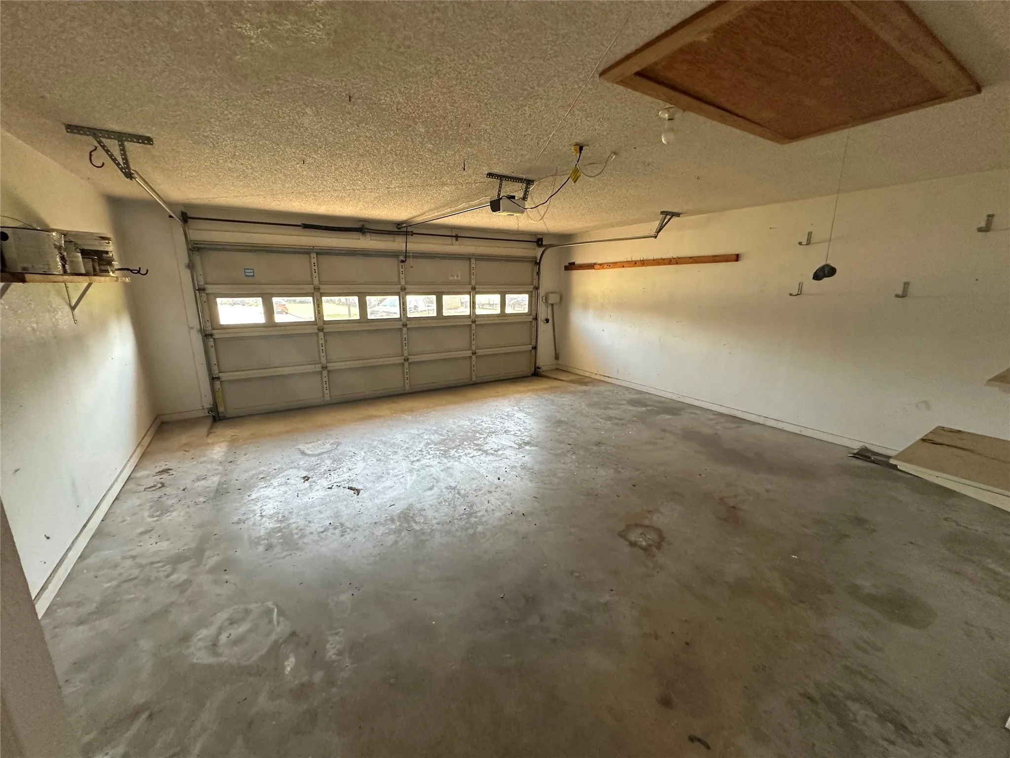 Garage featuring baseboards