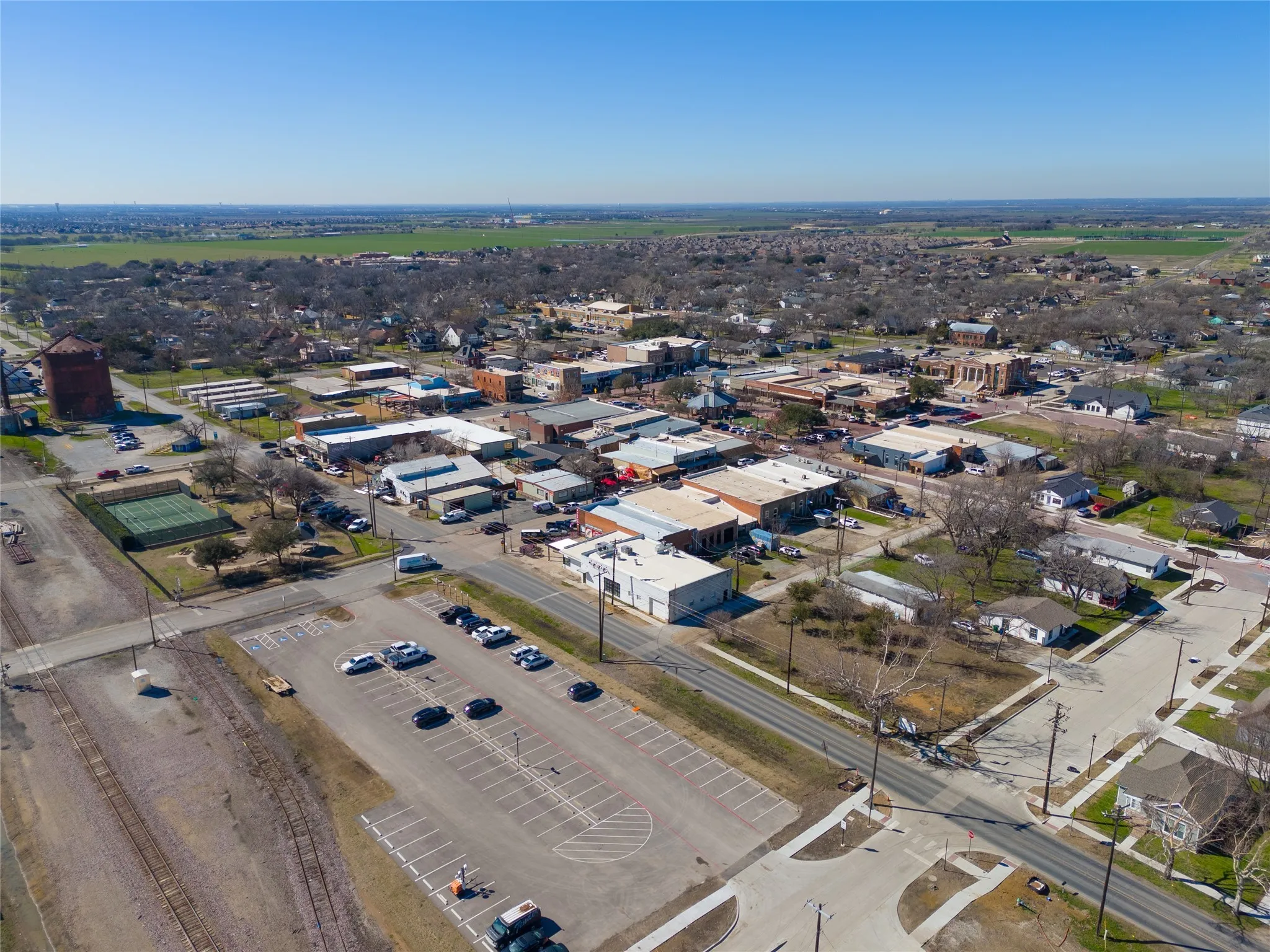 Aerial view of property's location with an industrial area