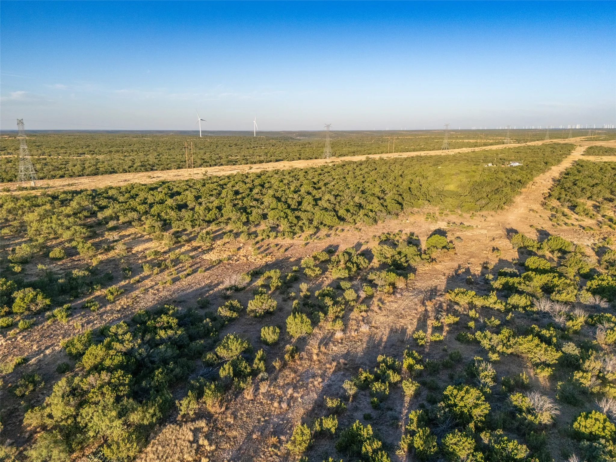 Aerial view of property and surrounding area featuring rural landscape
