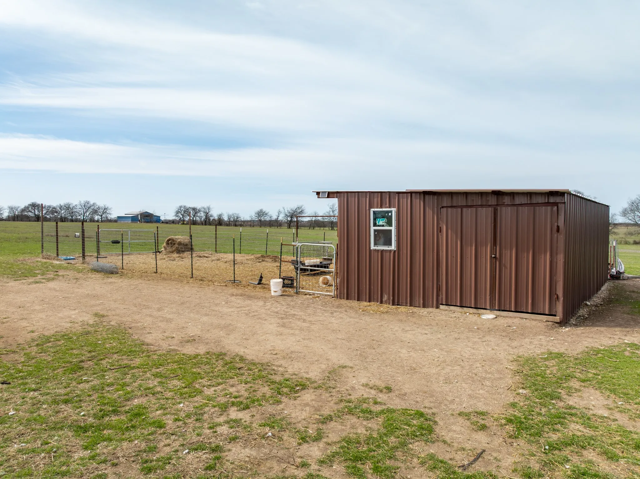 View of outdoor structure featuring a view of countryside
