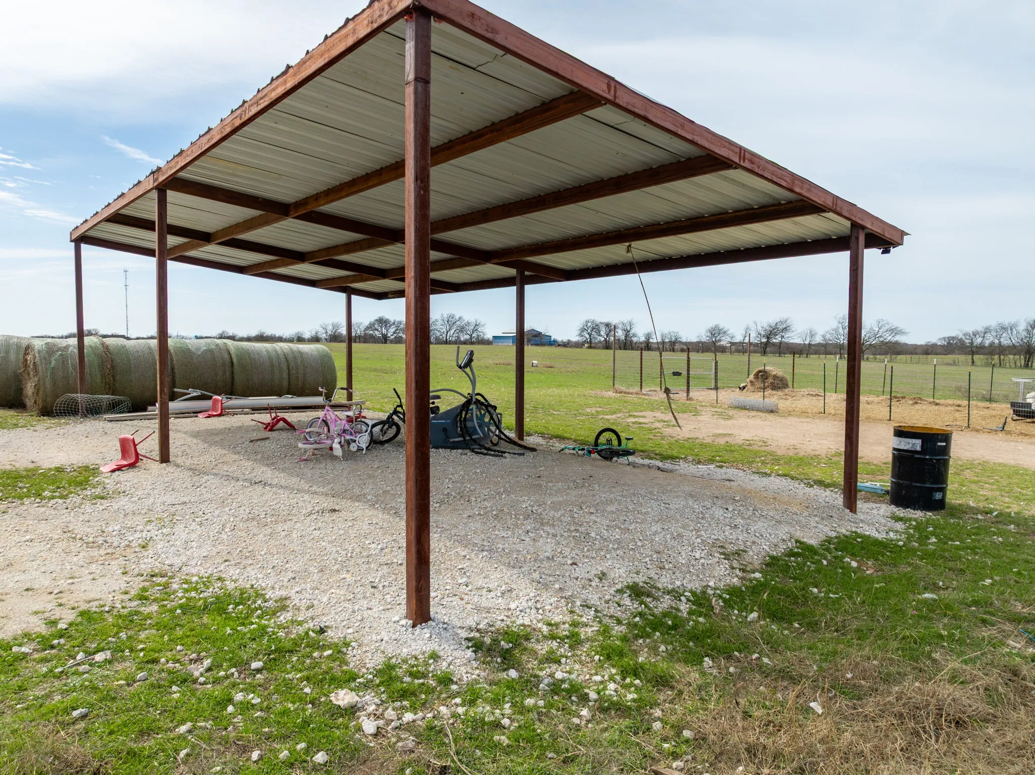 View of property's community featuring a yard and a view of countryside