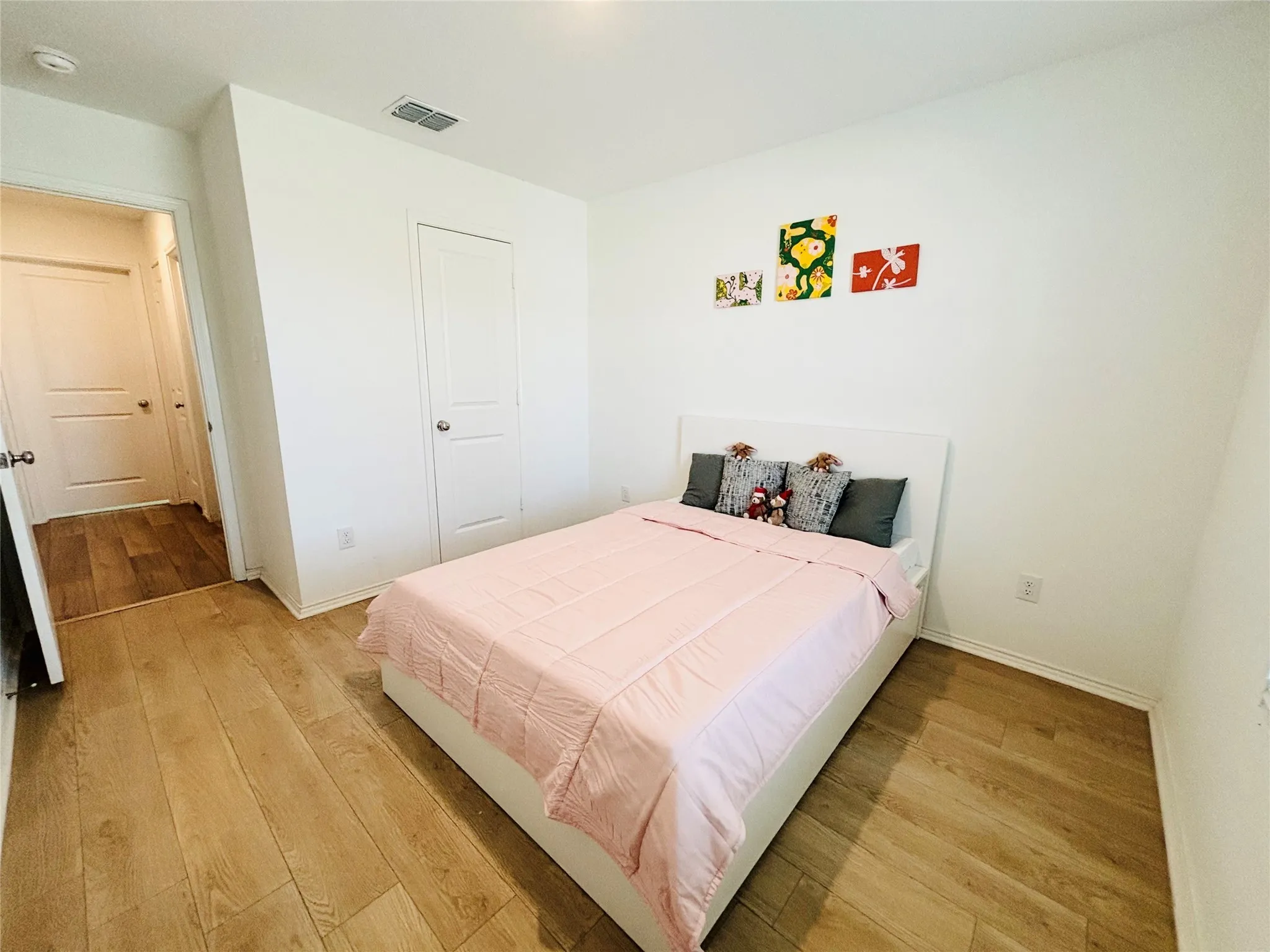 Bedroom with light wood-style floors