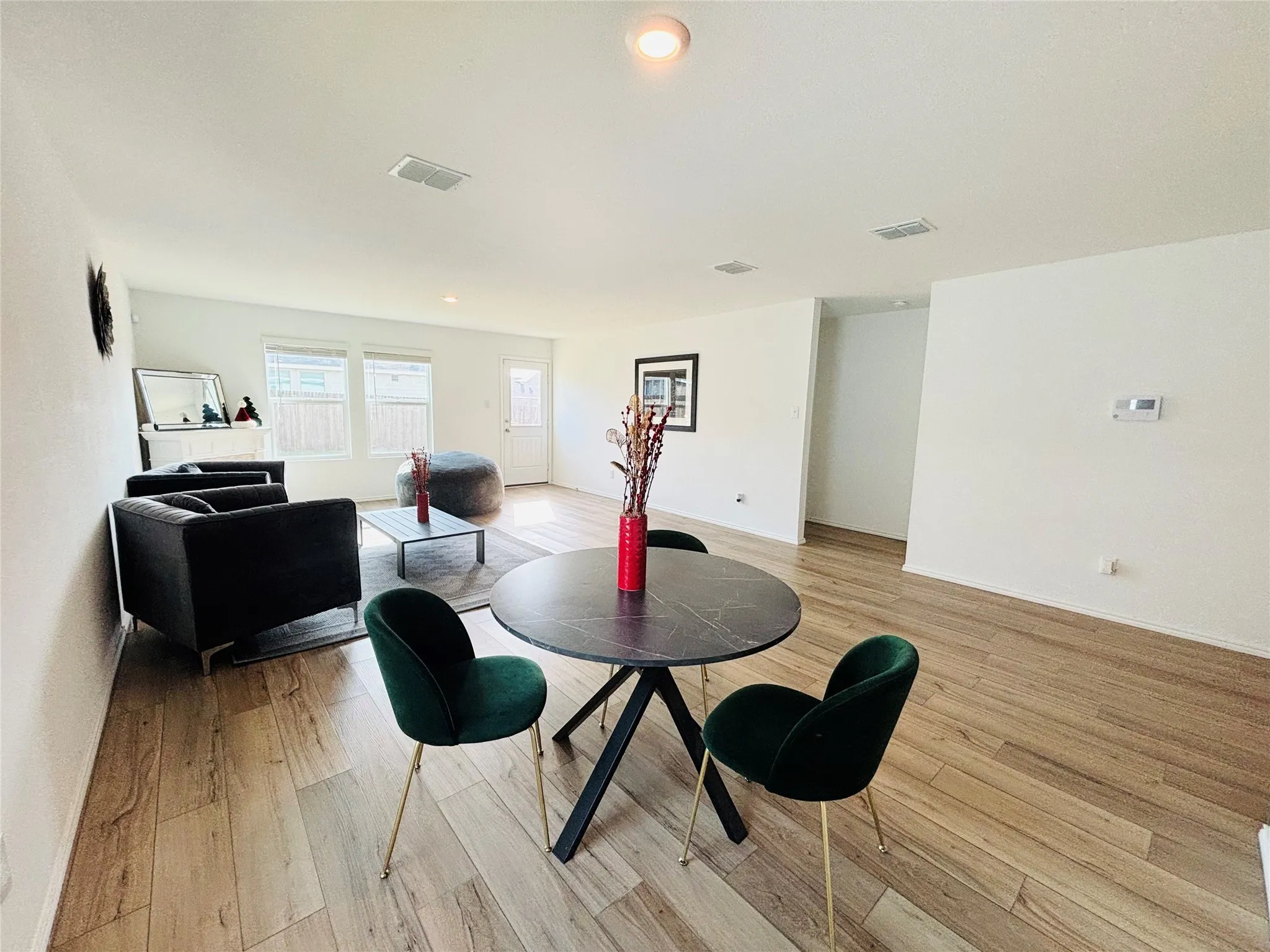 Dining area featuring light wood-style flooring and recessed lighting