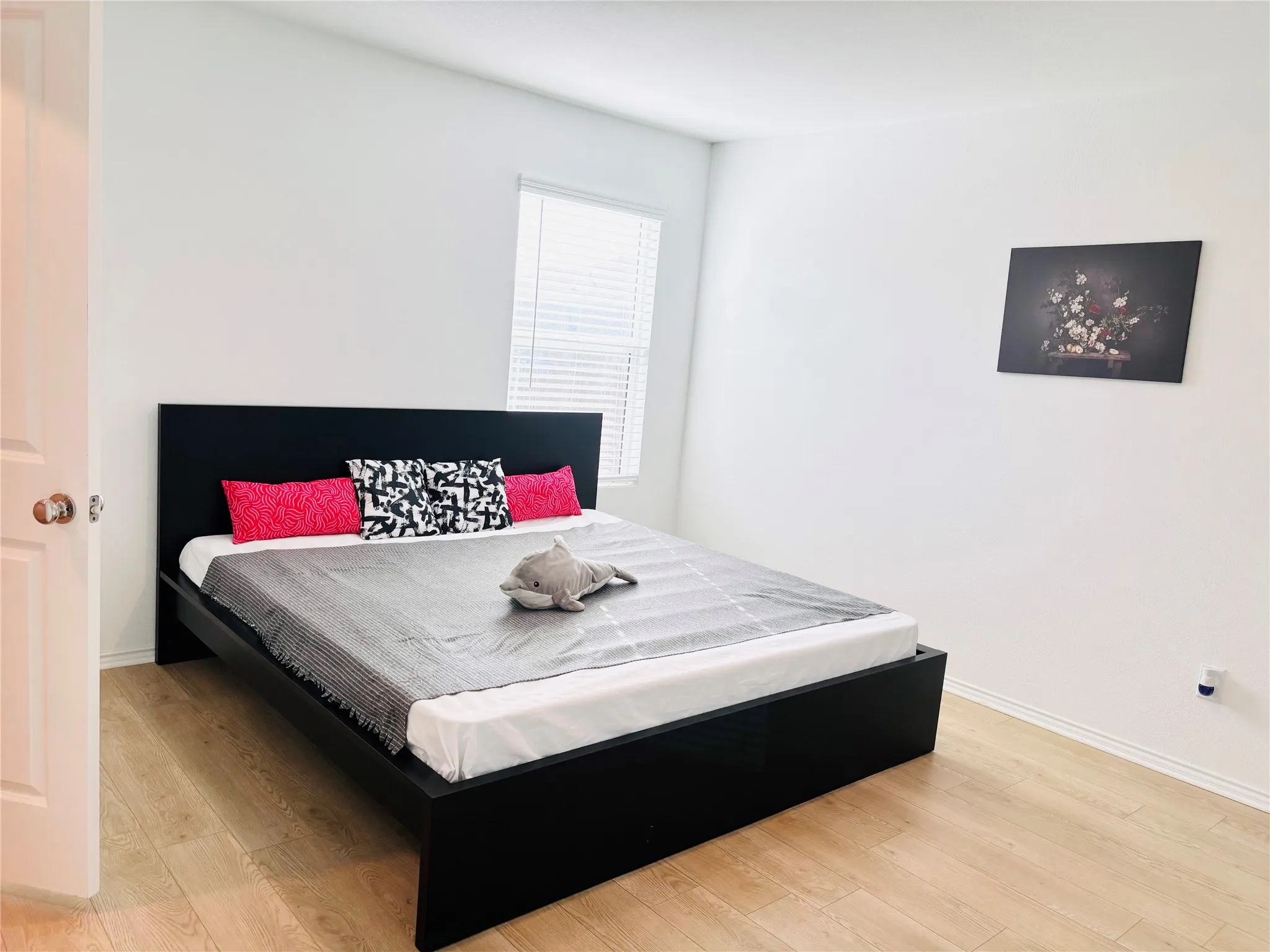 Bedroom featuring light wood-type flooring and baseboards