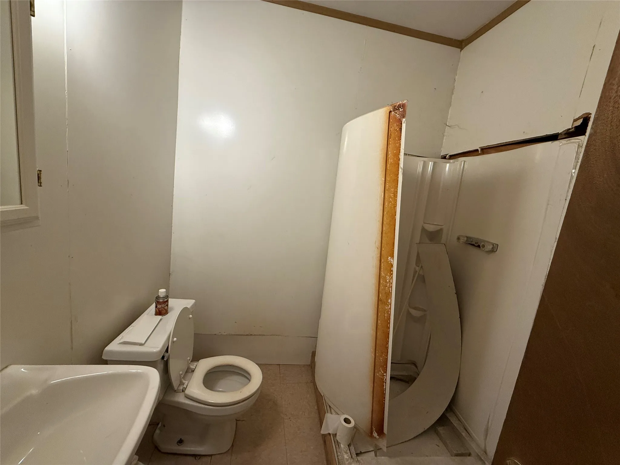 Bathroom featuring toilet and crown molding