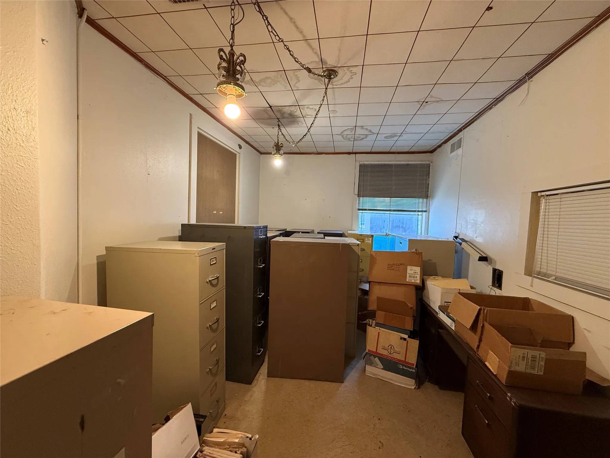 Below grade area featuring a drop ceiling