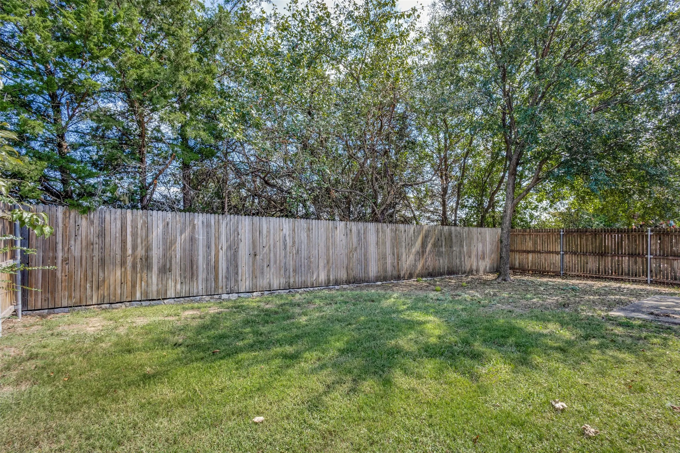 View of fenced backyard
