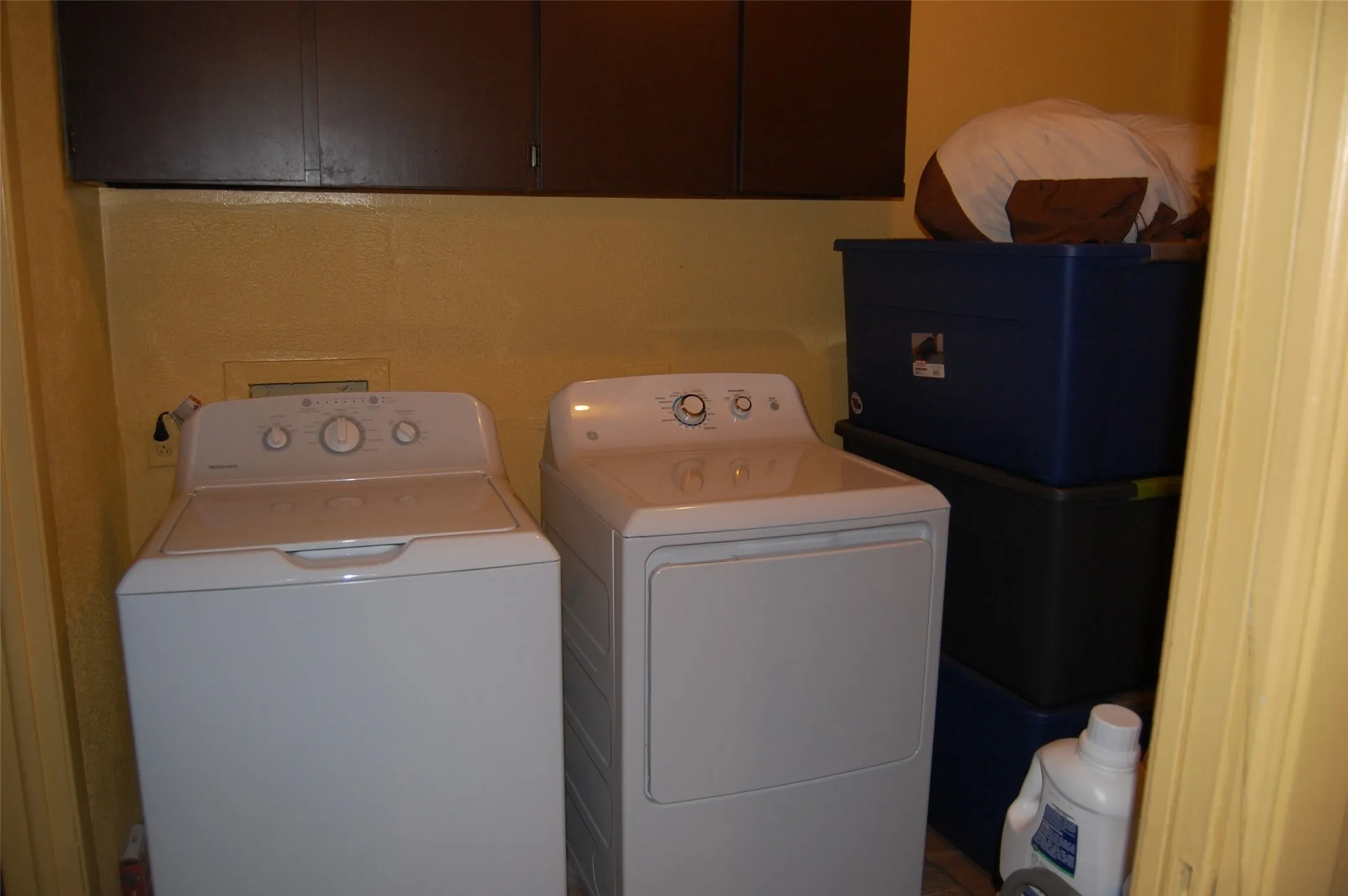 Laundry area with washing machine and dryer and cabinet space