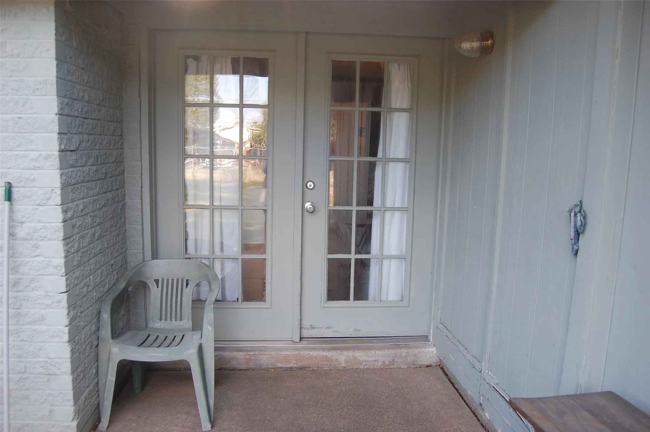 Back Doorway to property featuring french doors