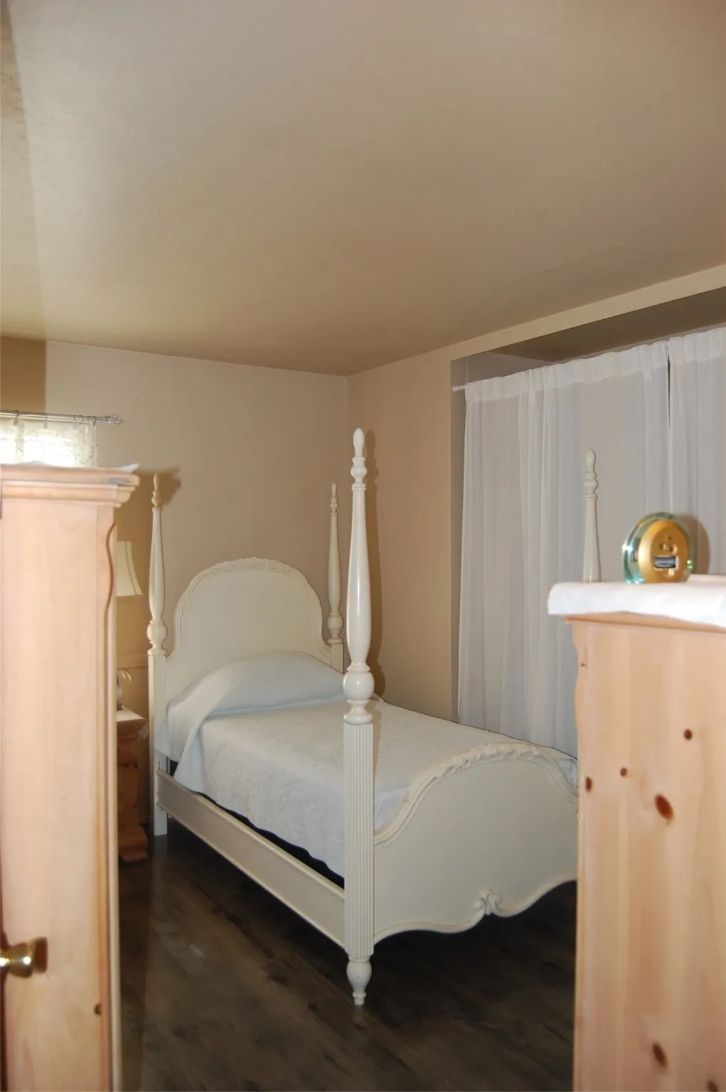 Bedroom with dark wood-type flooring