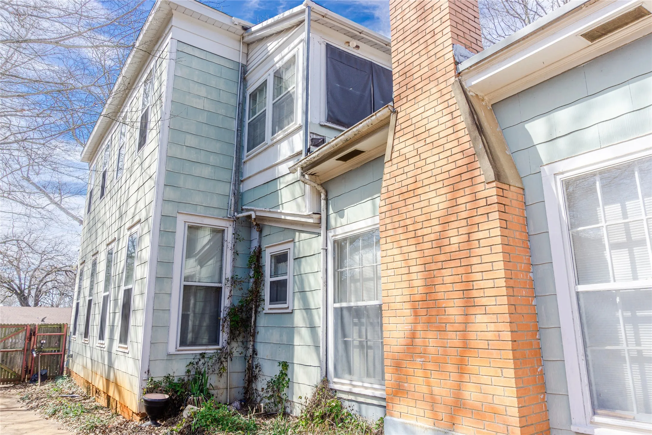 View of side of property with a chimney