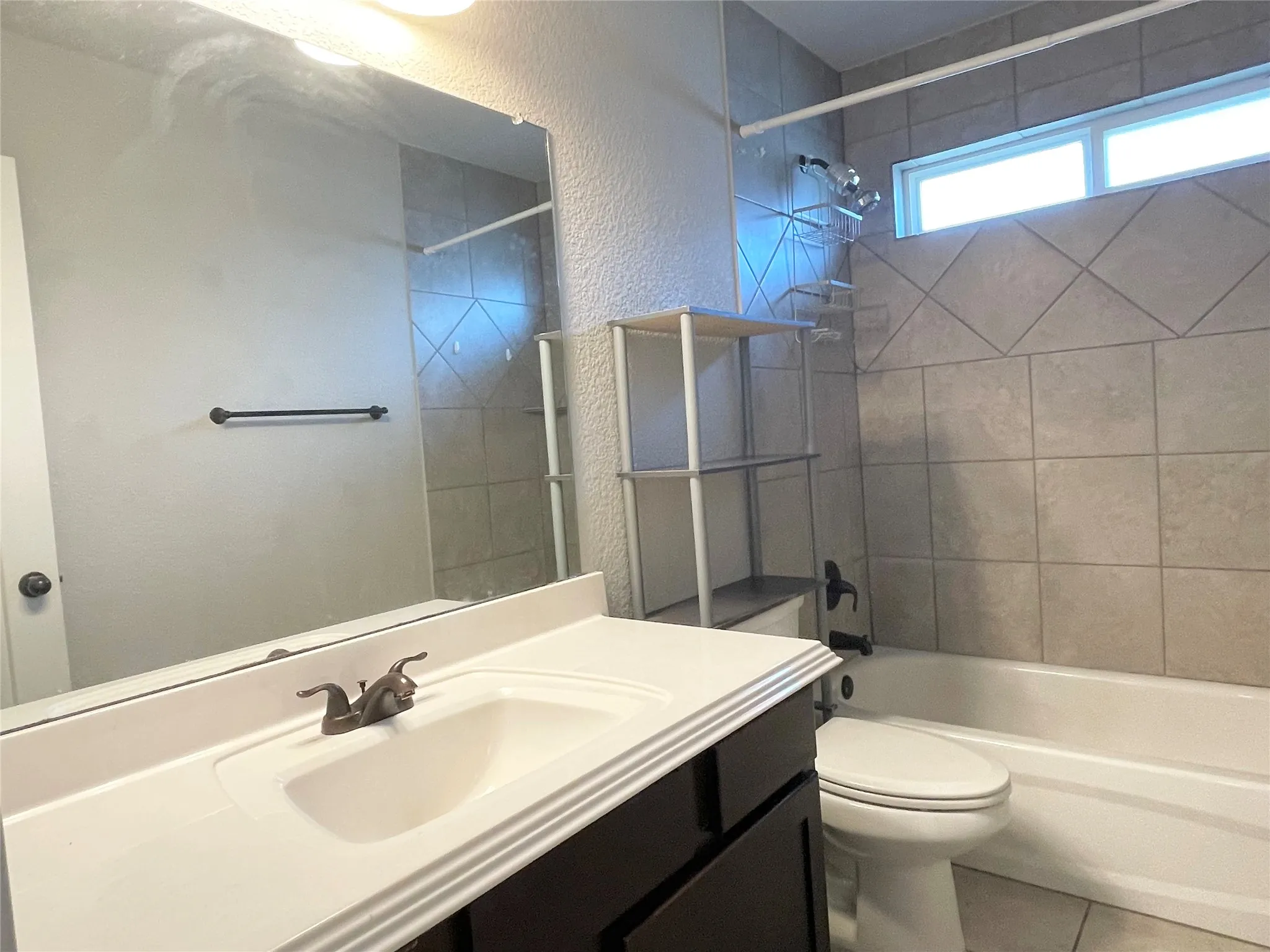 Full bathroom featuring shower / bath combination, vanity, and tile floors