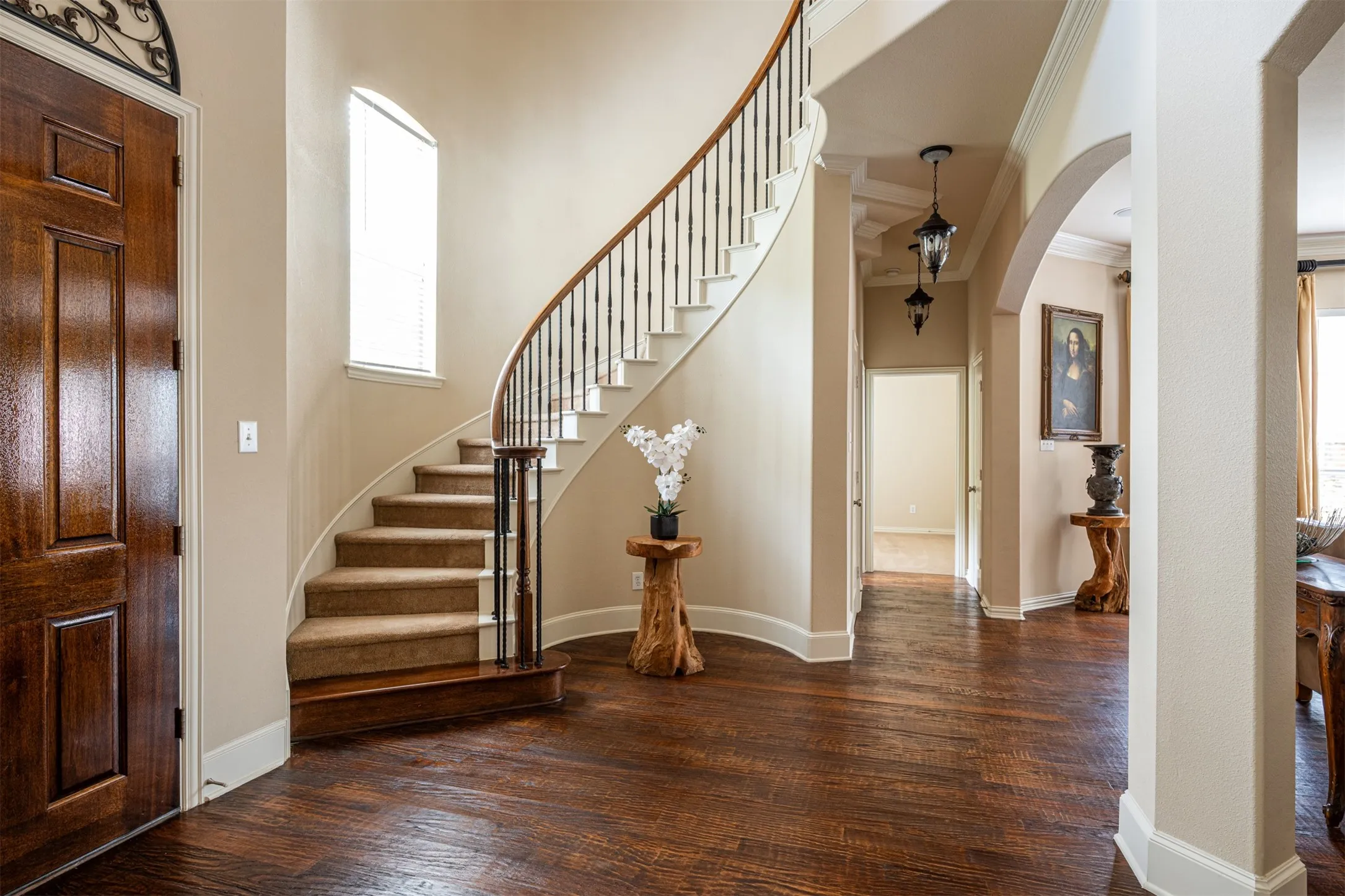 Vaulted Foyer Entrance, archway, showcasing the stunning spiral staircase leading to 2nd level