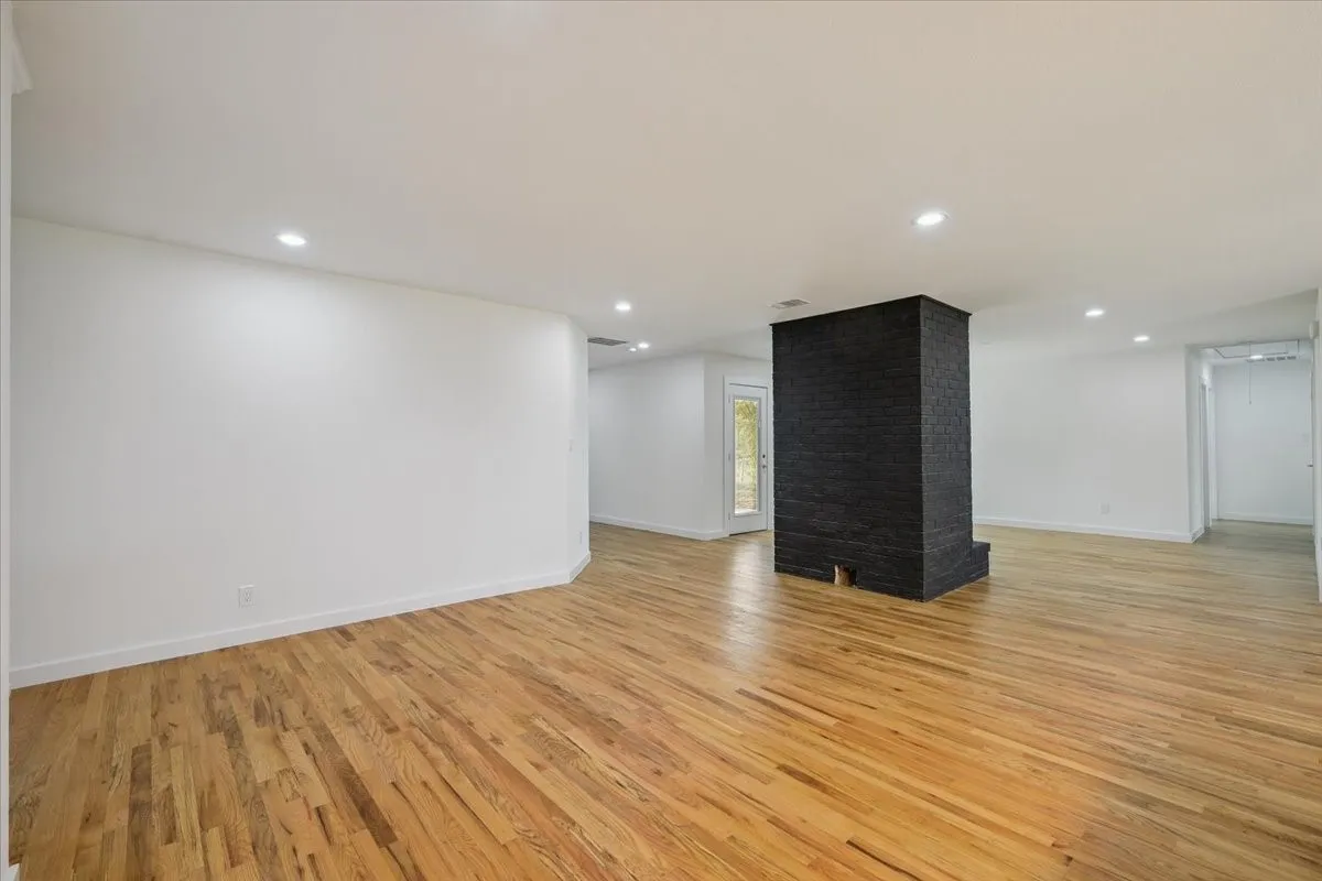 Unfurnished living room featuring light wood-style flooring and recessed lighting