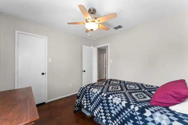 Bedroom with baseboards and a ceiling fan
