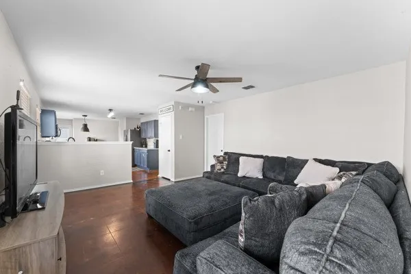 Living room featuring ceiling fan