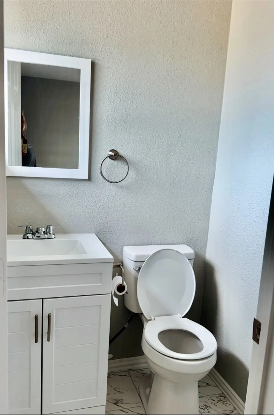 Primary Bathroom featuring tile patterned floors, vanity, and toilet