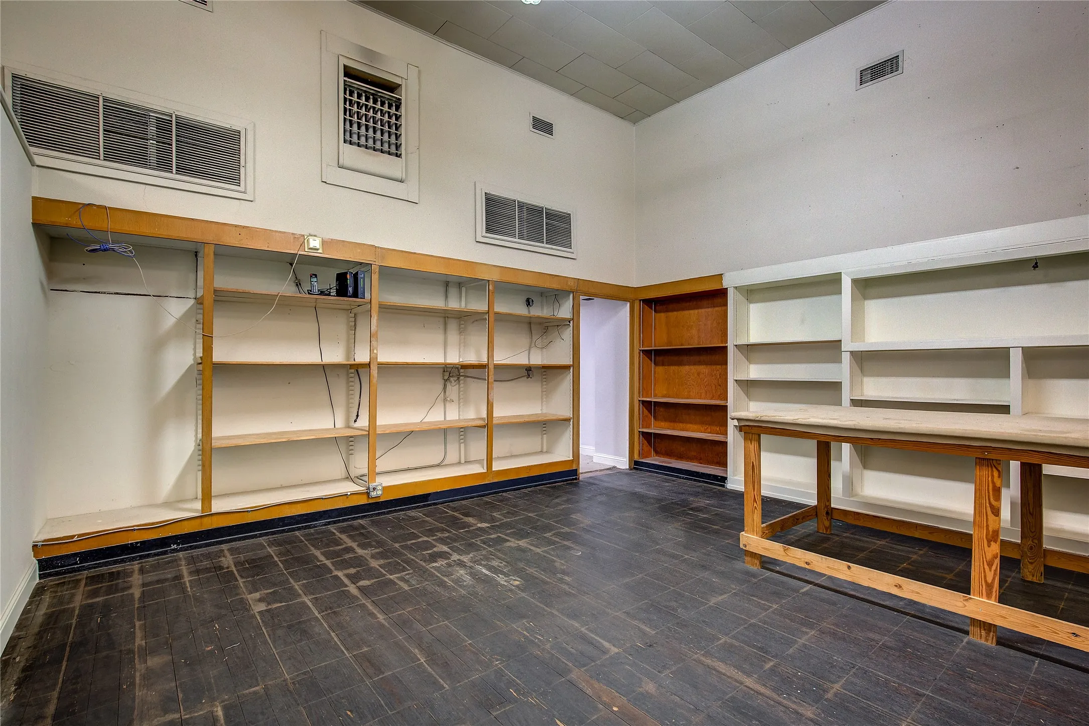 HUGE storage/work space has more built-in shelving; this shows about half of the available work area in the back.