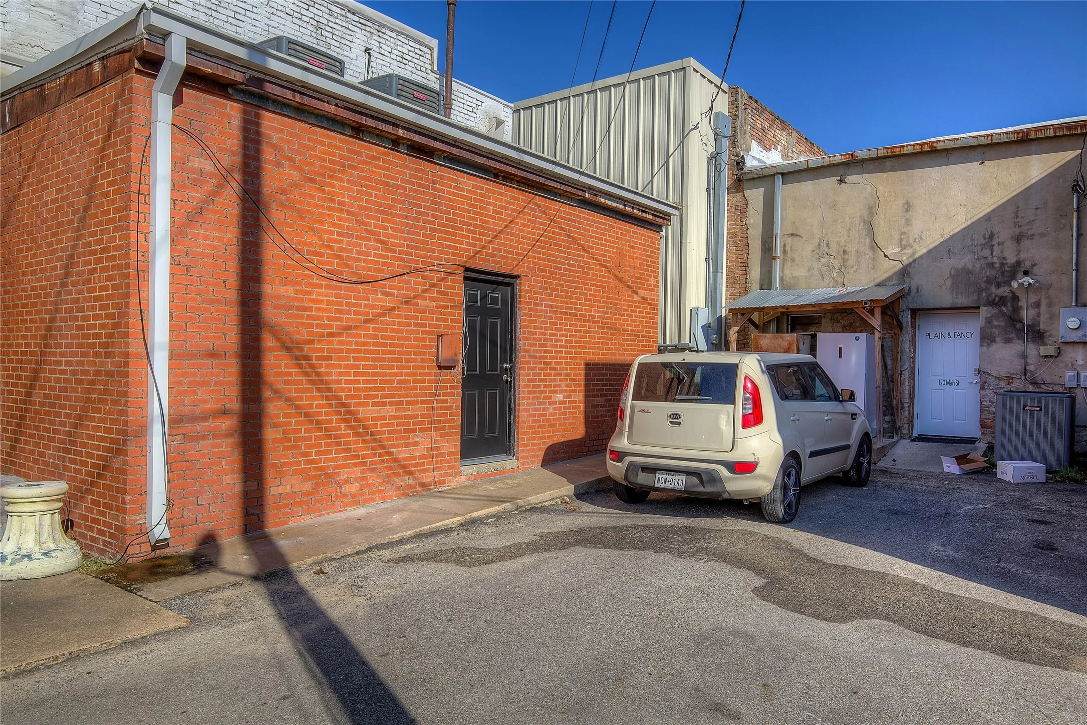 View of building exterior; this enters into the office off the alley behind the building