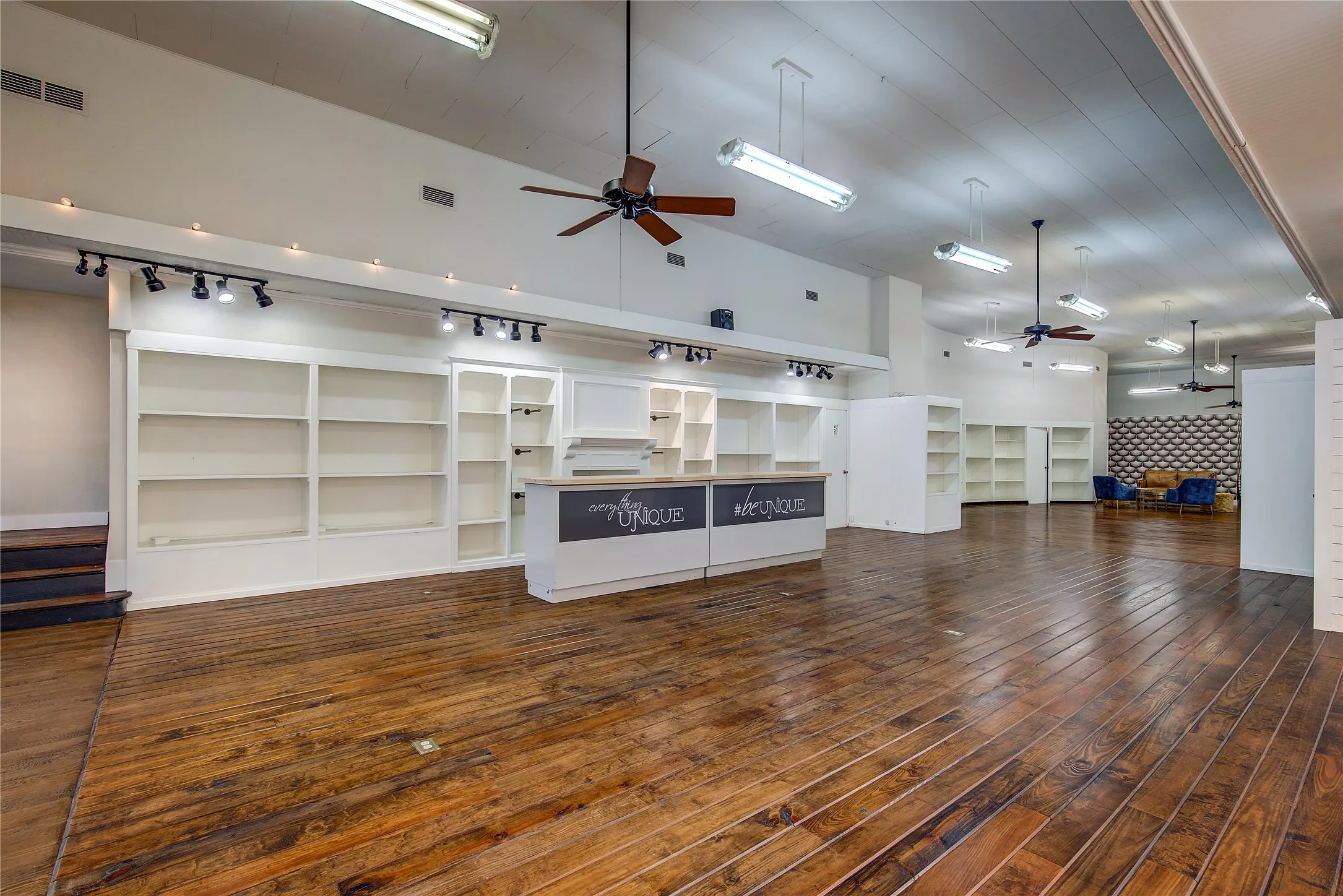 Looking towards the back of the store. High ceilings make the space seem even larger