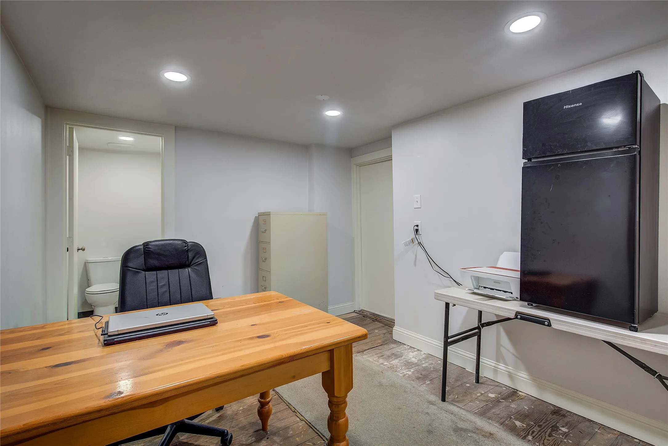 Office is also on main floor, has private half-bath and an entrance into the alley behind the store.