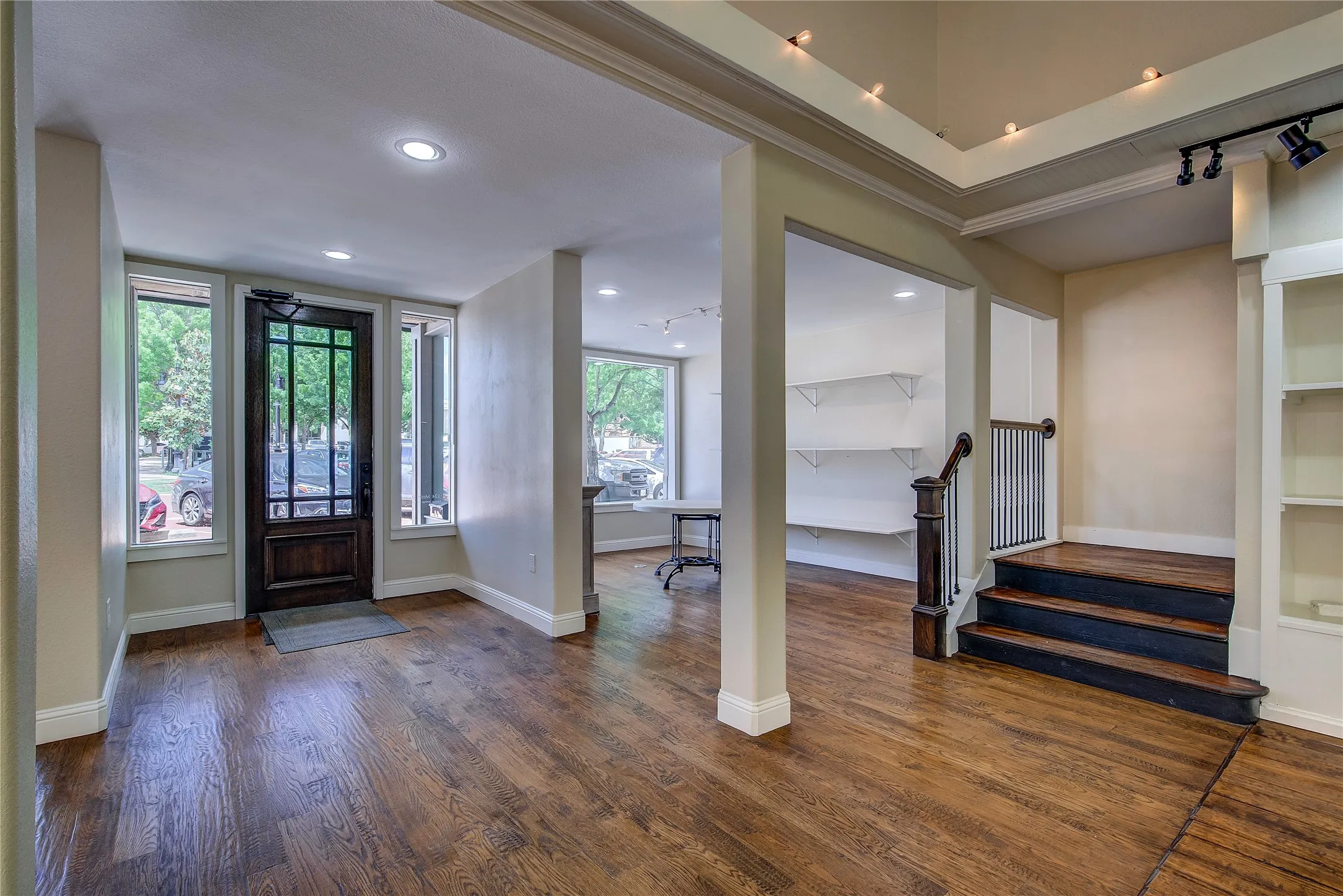 Foyer entrance; hand-scraped hardwood floors throughout the retail area, and look how much light the windows bring in!