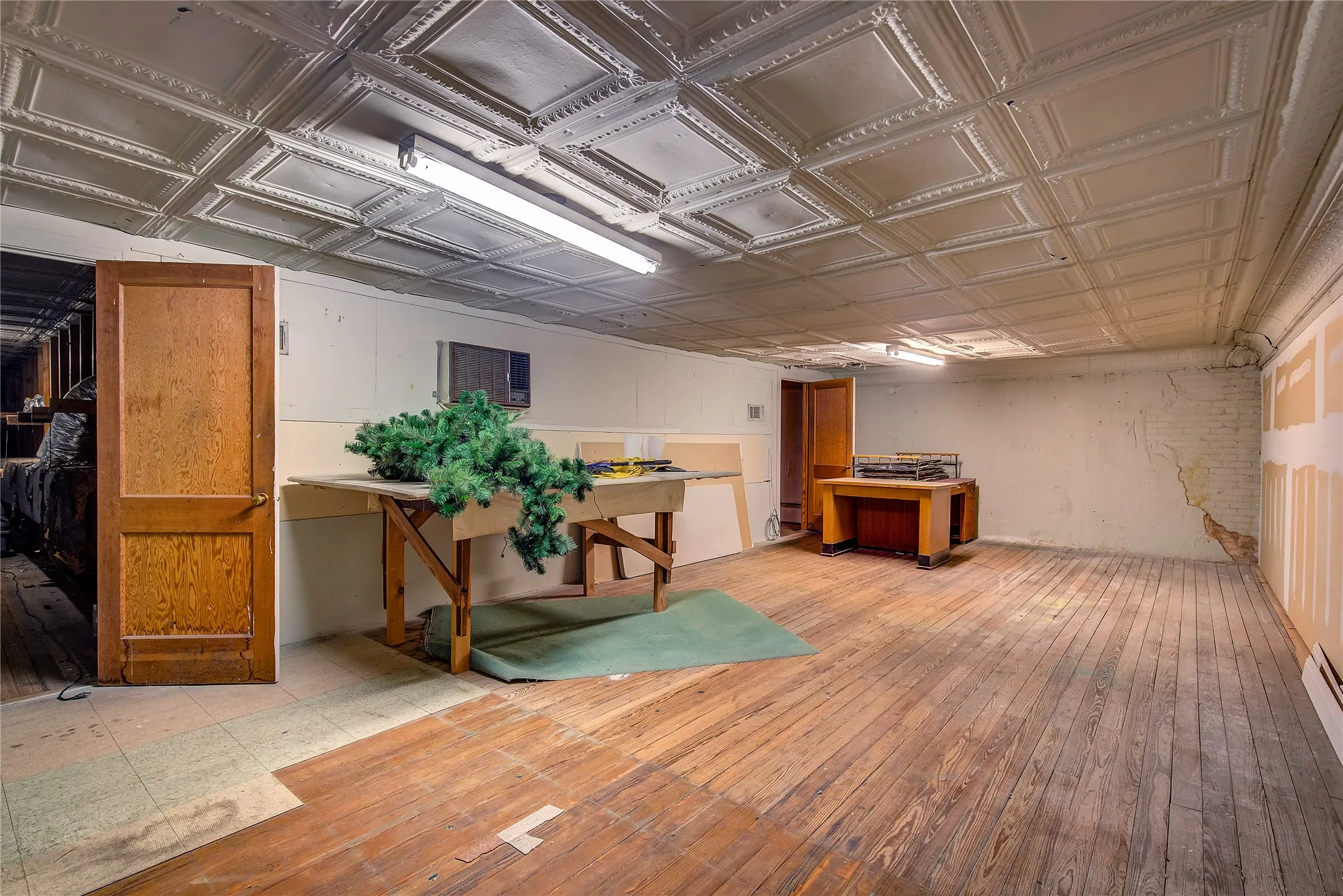 UPSTAIRS!  Partly finished out. Could be offices, storage or even an apartment!