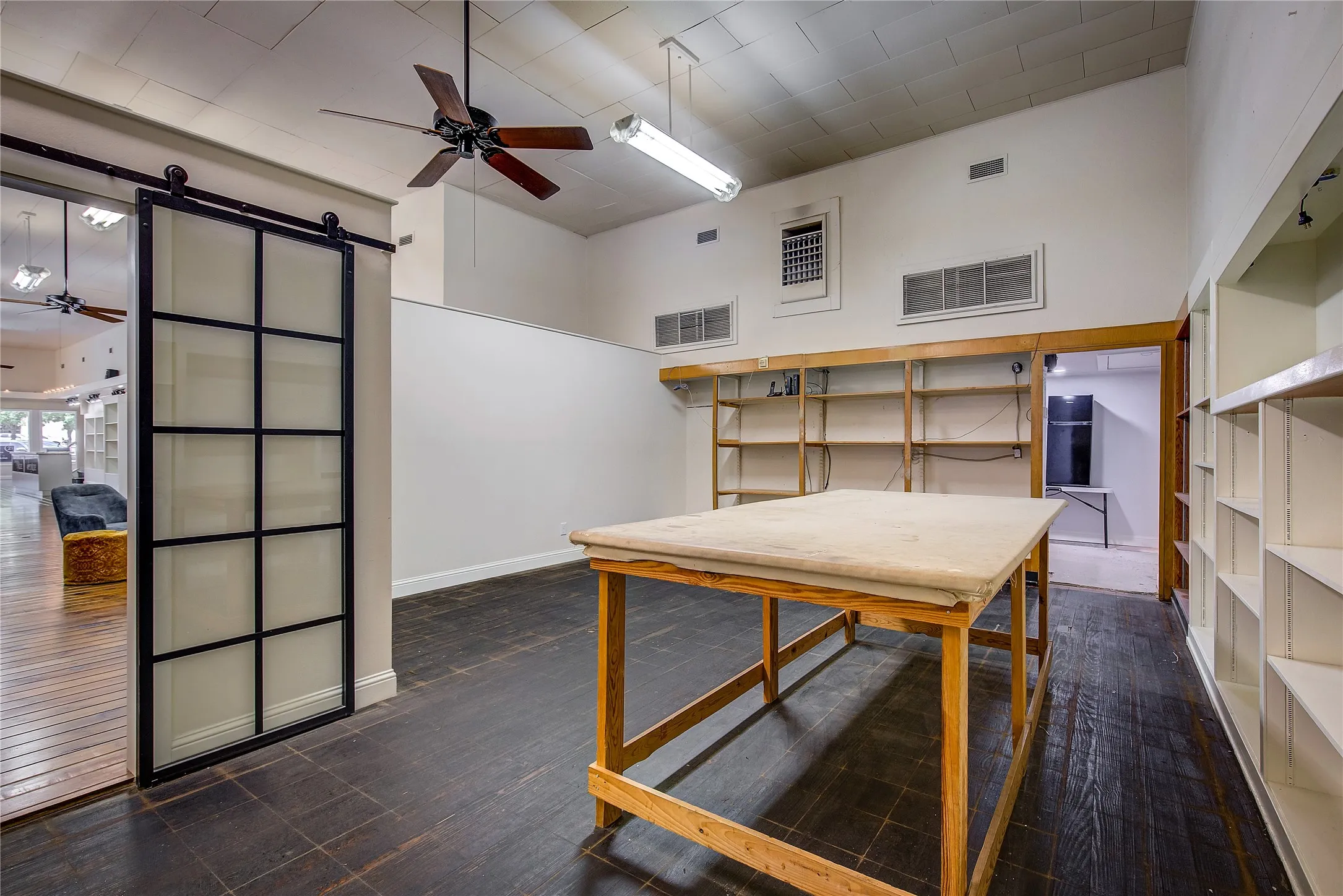 Half of storage area, facing the office; the showroom/bar is visible to the left.