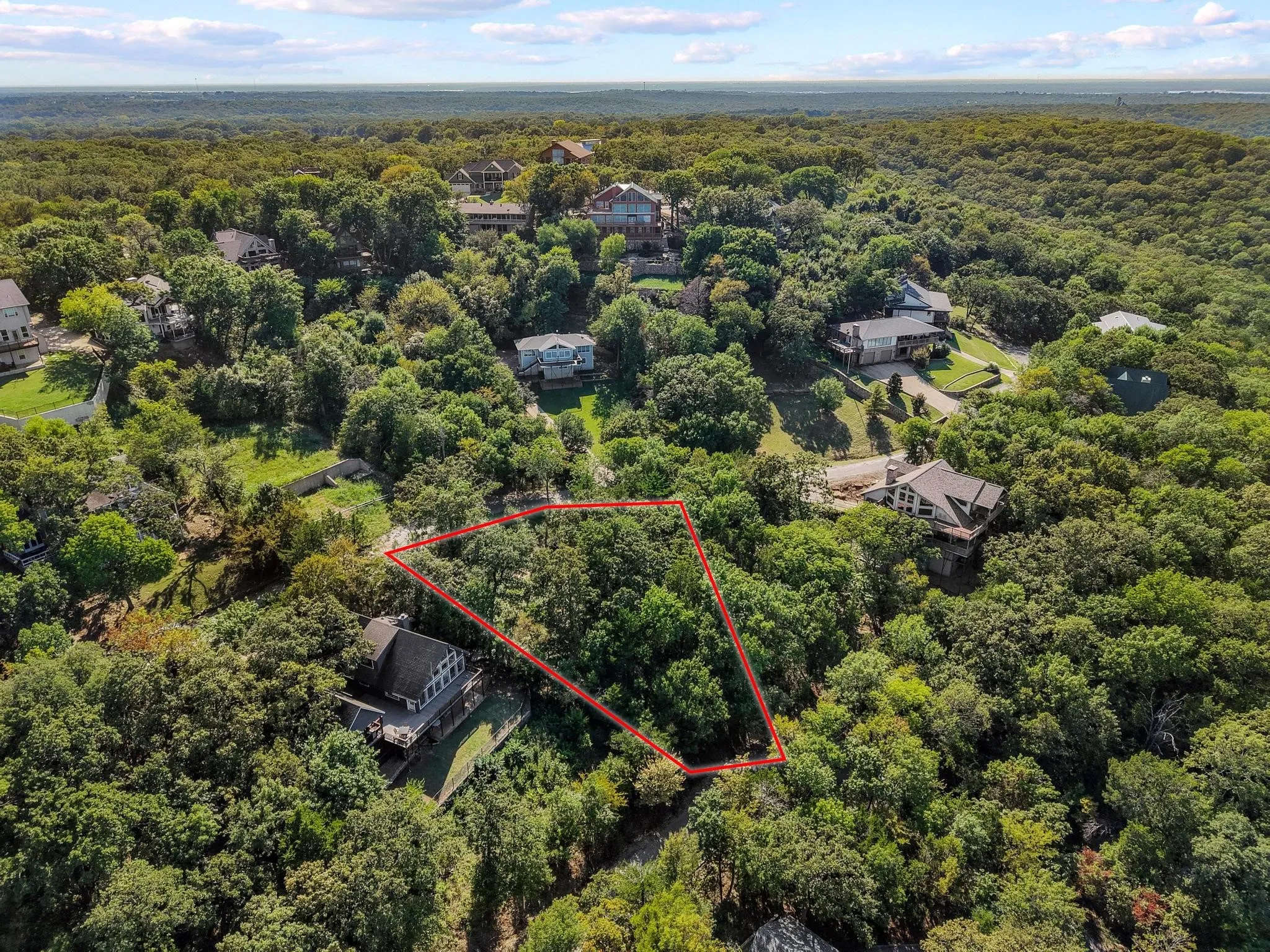 View of property location featuring a forest and property boundaries highlighted