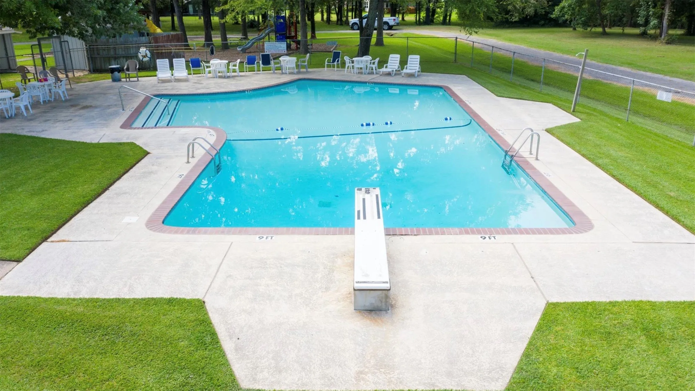 Community pool featuring a patio area