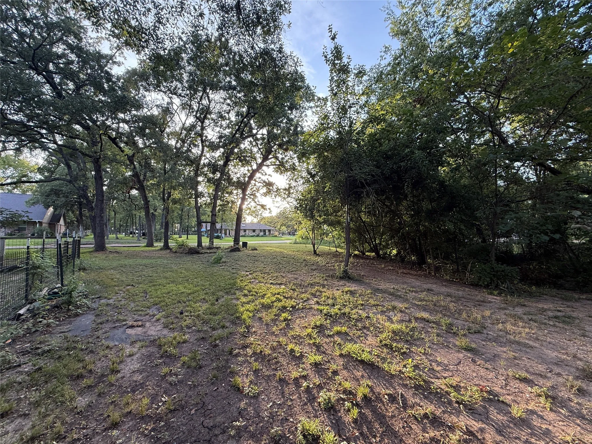View of yard with view of wooded area