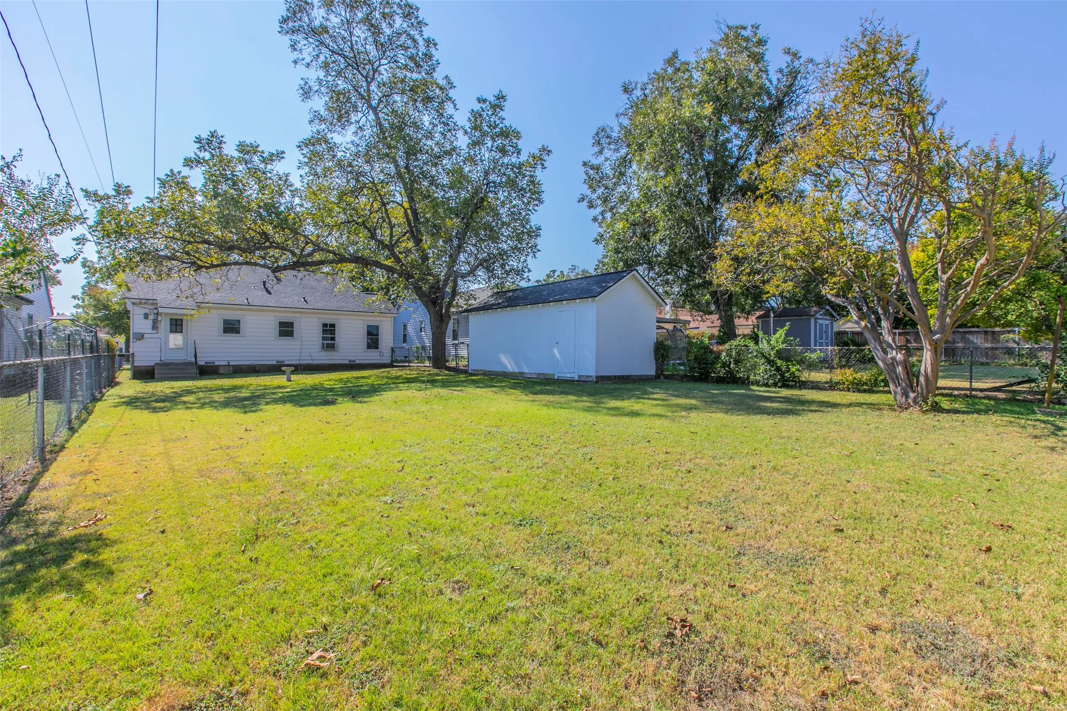 View of fenced backyard