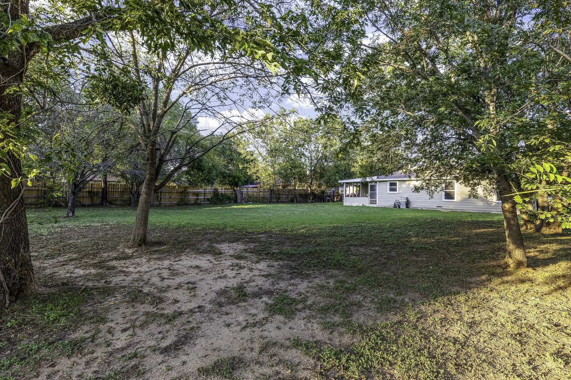 View of fenced backyard