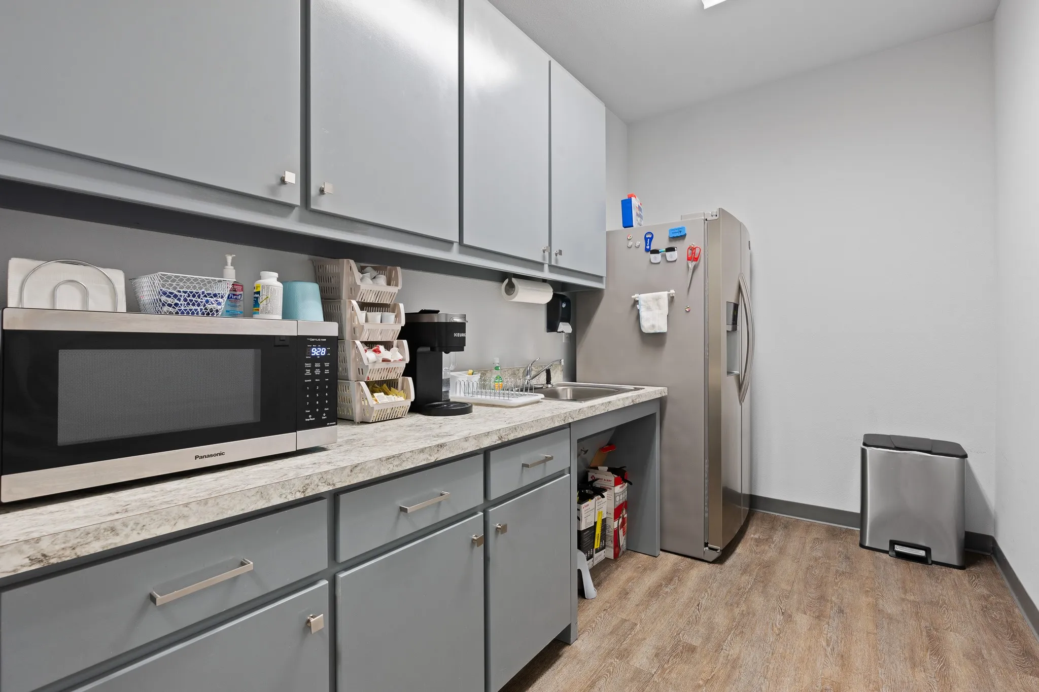 Spacious kitchen/break room area with sink and room for full size refrigerator