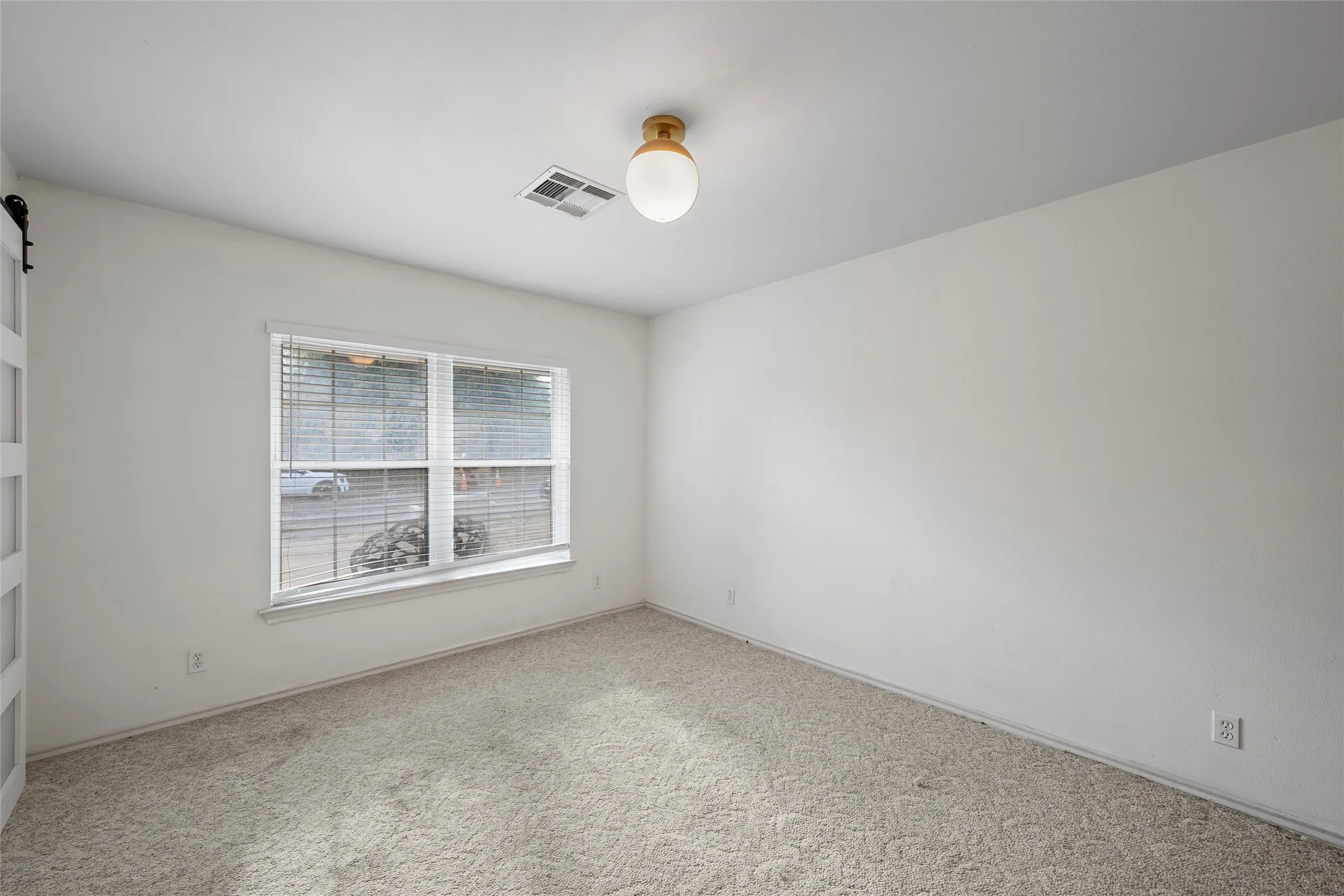 Empty room featuring carpet floors and baseboards