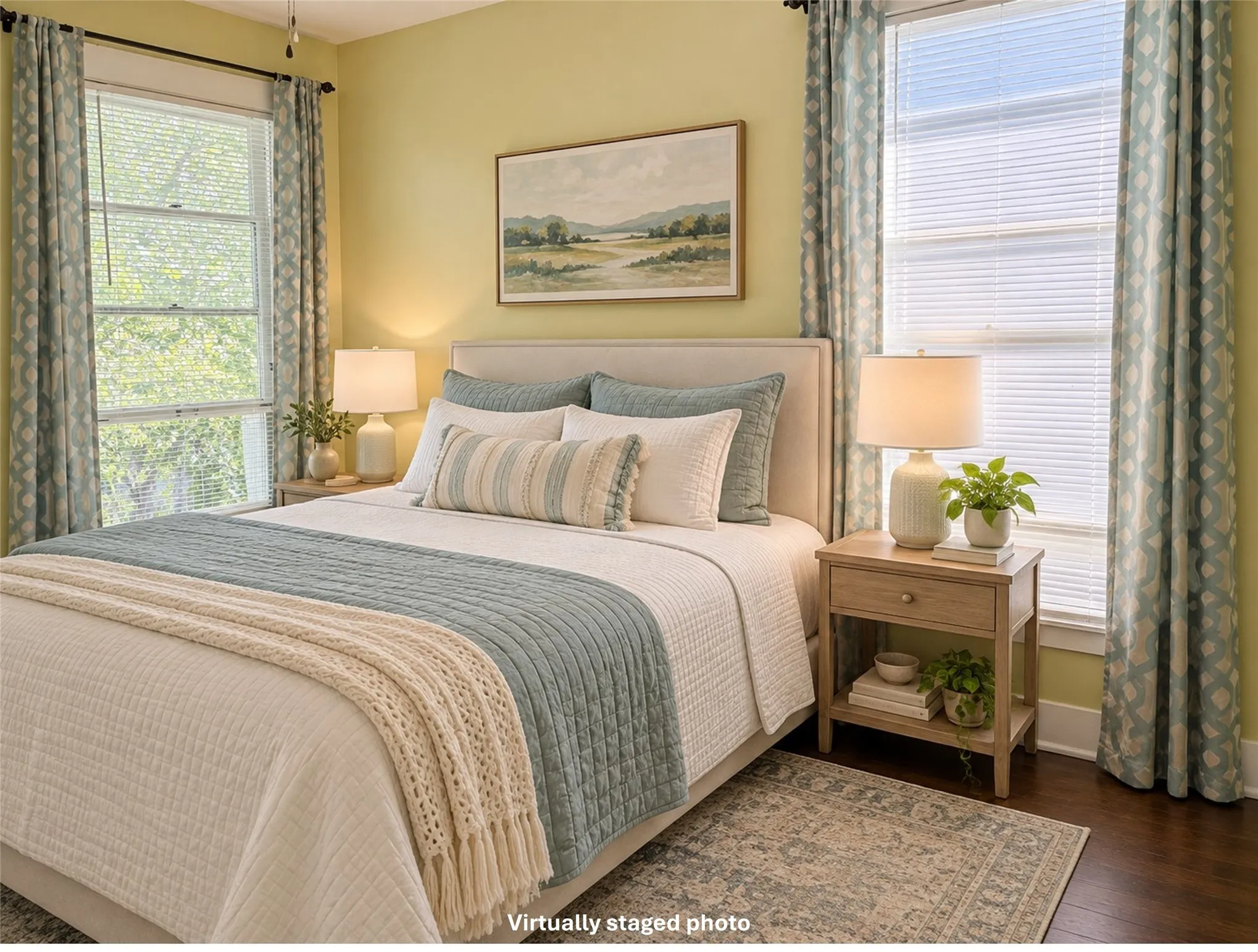 Virtually staged bedroom 2 with dark wood finished floors and baseboards