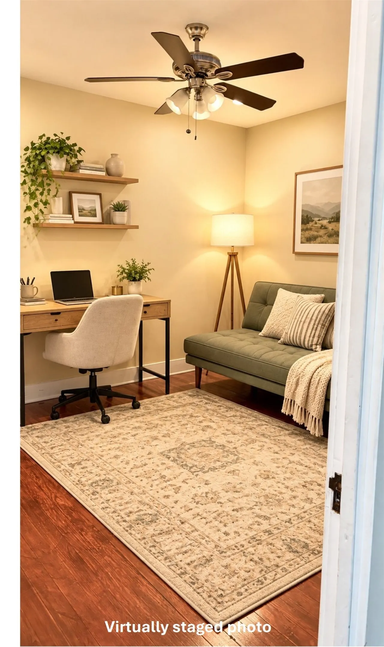 Virtually staged bedroom 1 as a home office with wood finished floors and a ceiling fan