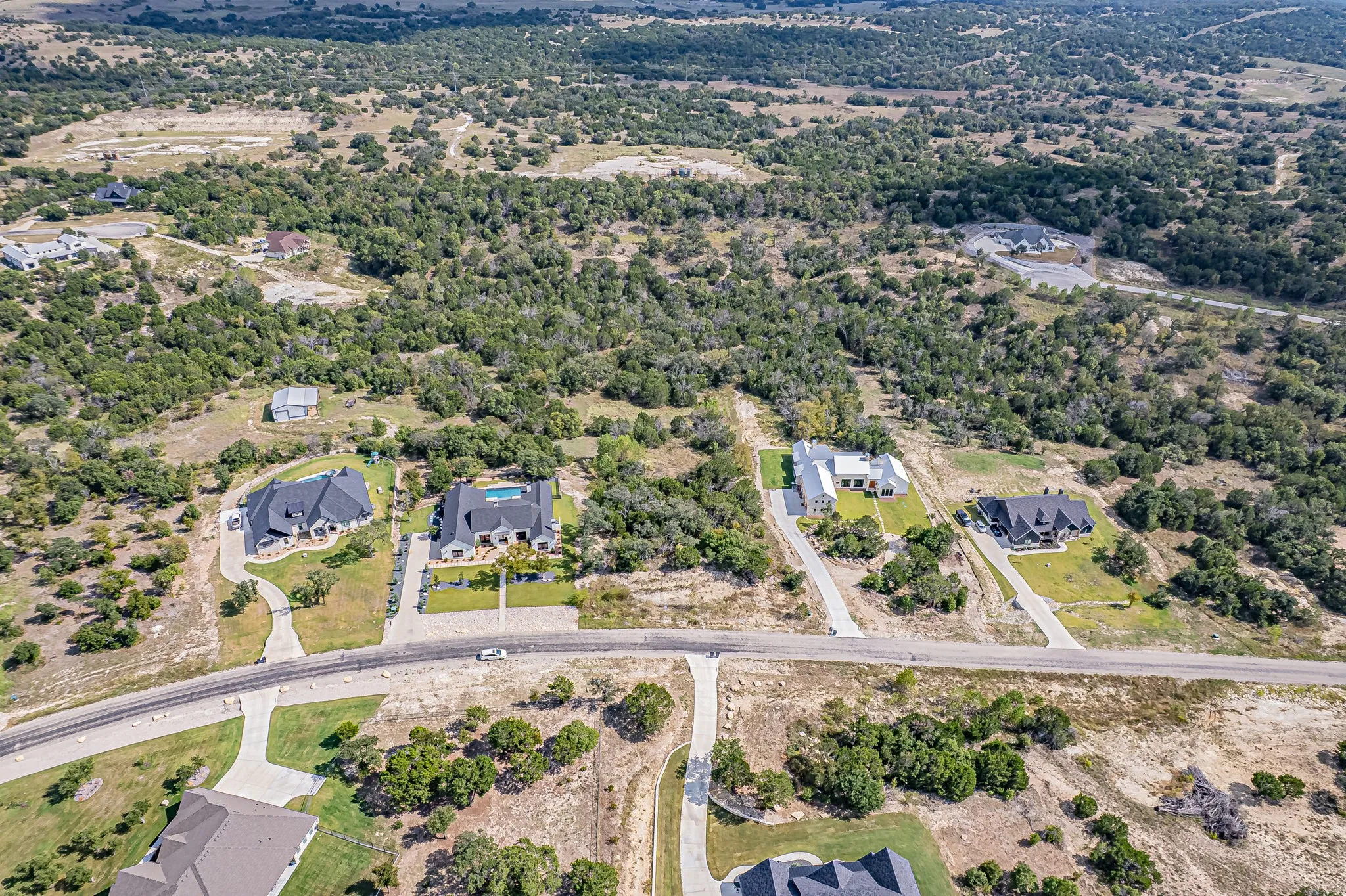 Aerial overview of property's location with nearby suburban area