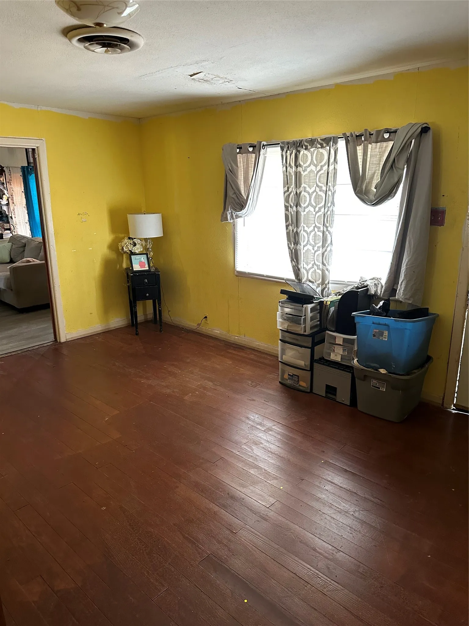 Unfurnished dining area featuring dark wood-style floors and baseboards