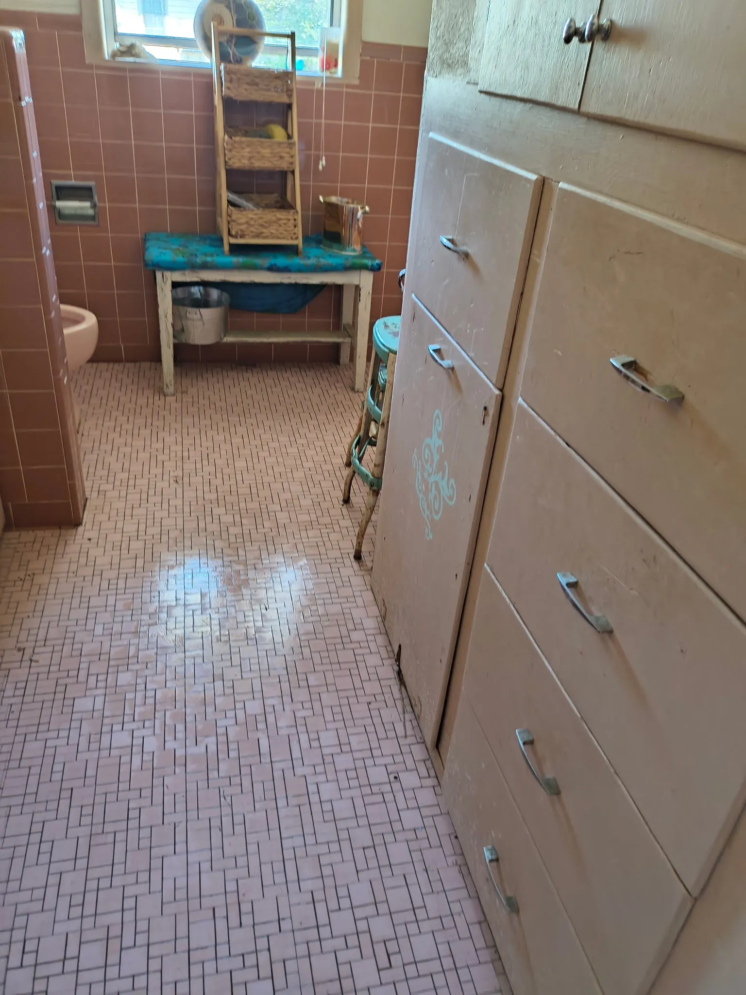 Built-in cabinetry with drawer and cabinet storage, complete with metal hardware