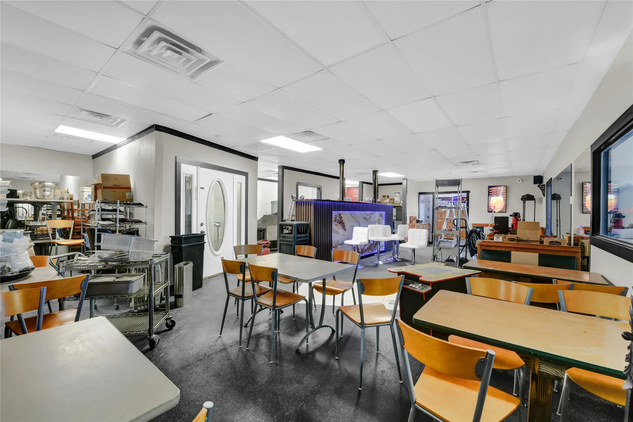 Dining area featuring a drop ceiling