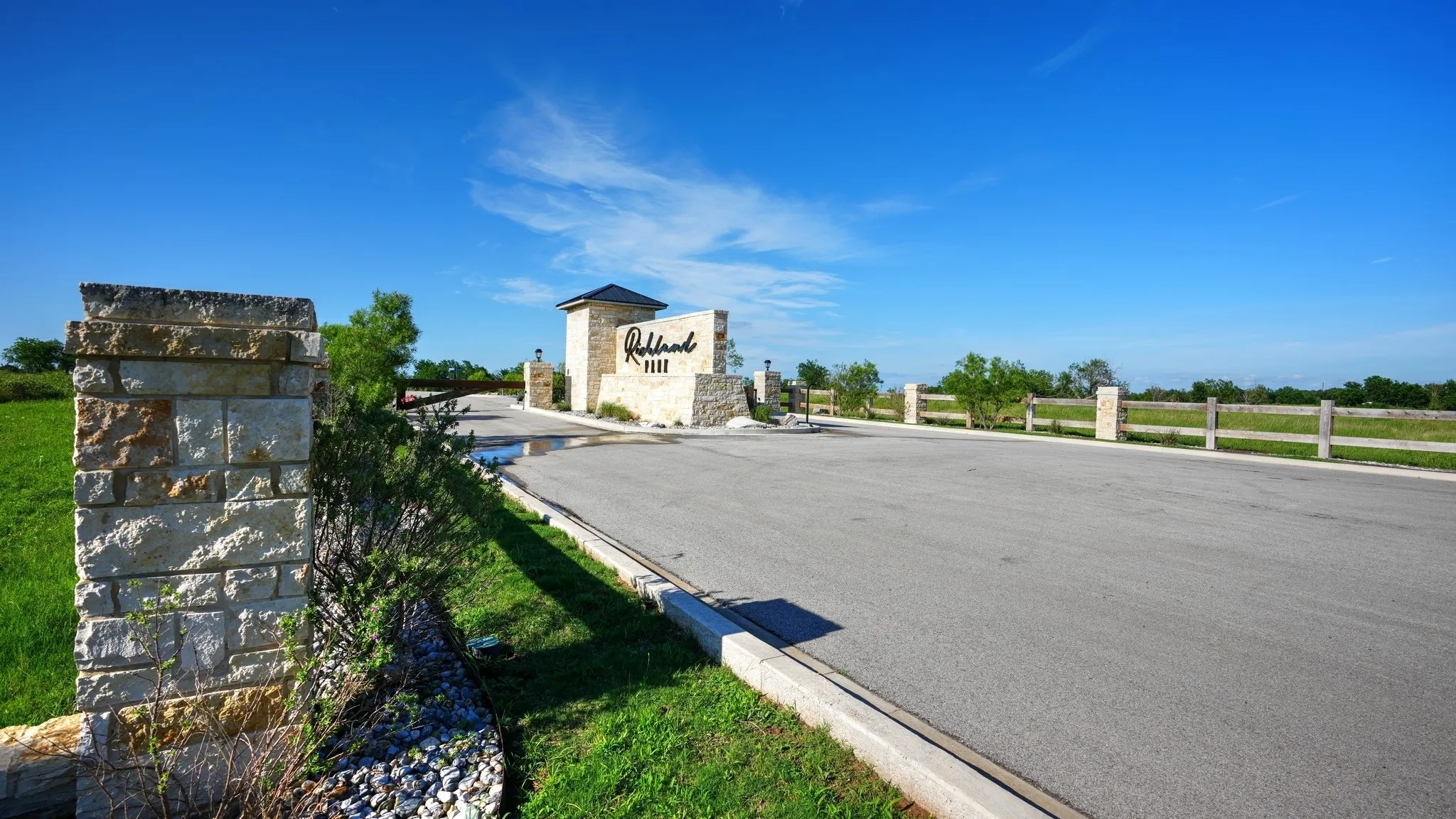 View of asphalt road with curbs