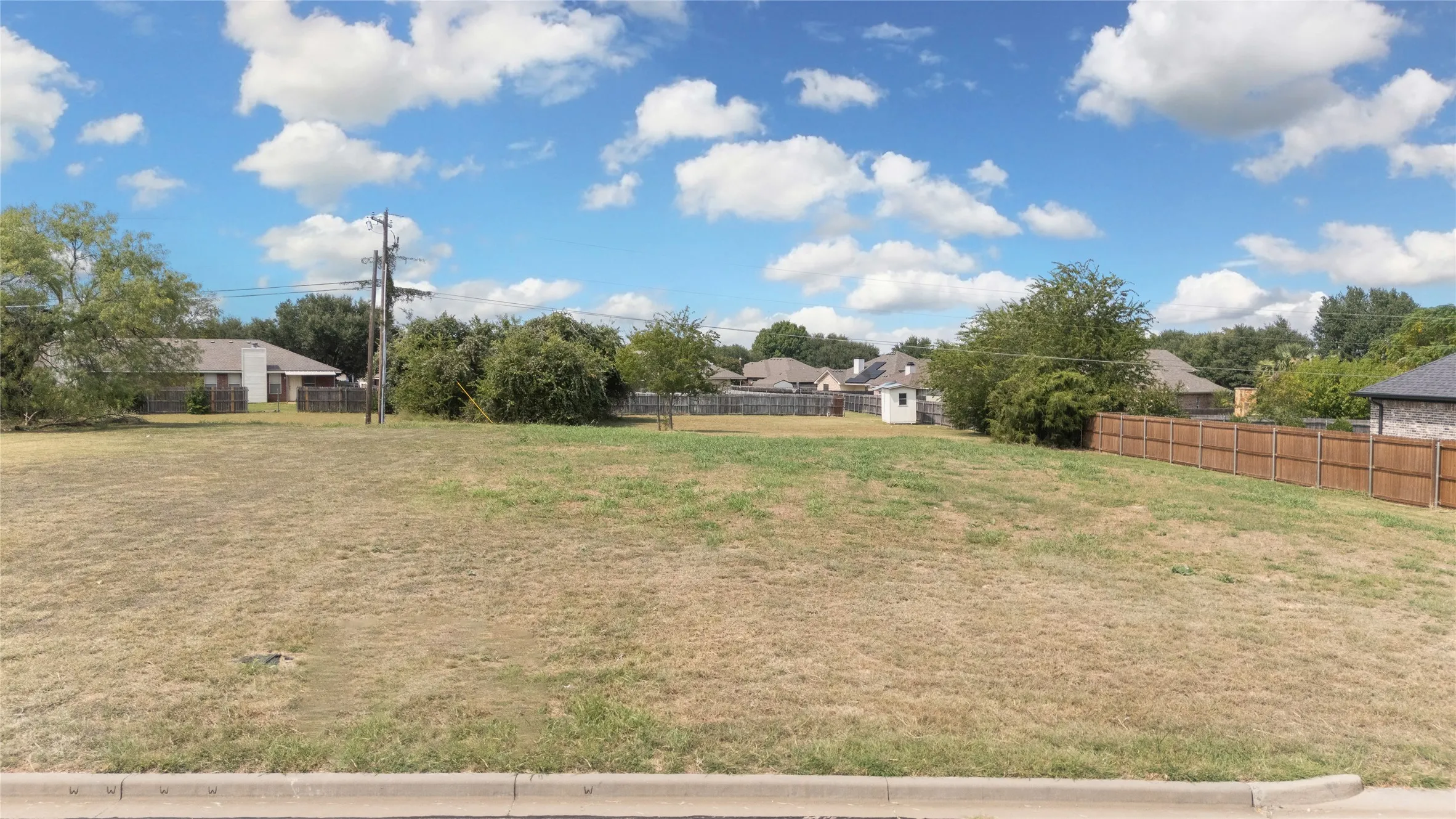 View of fenced backyard