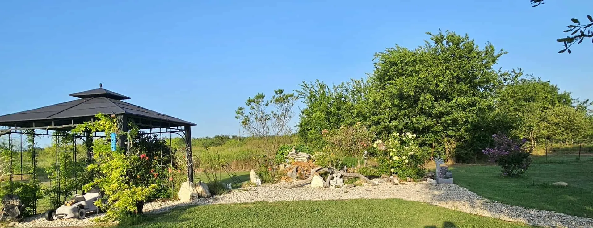 View of grassy yard with a gazebo