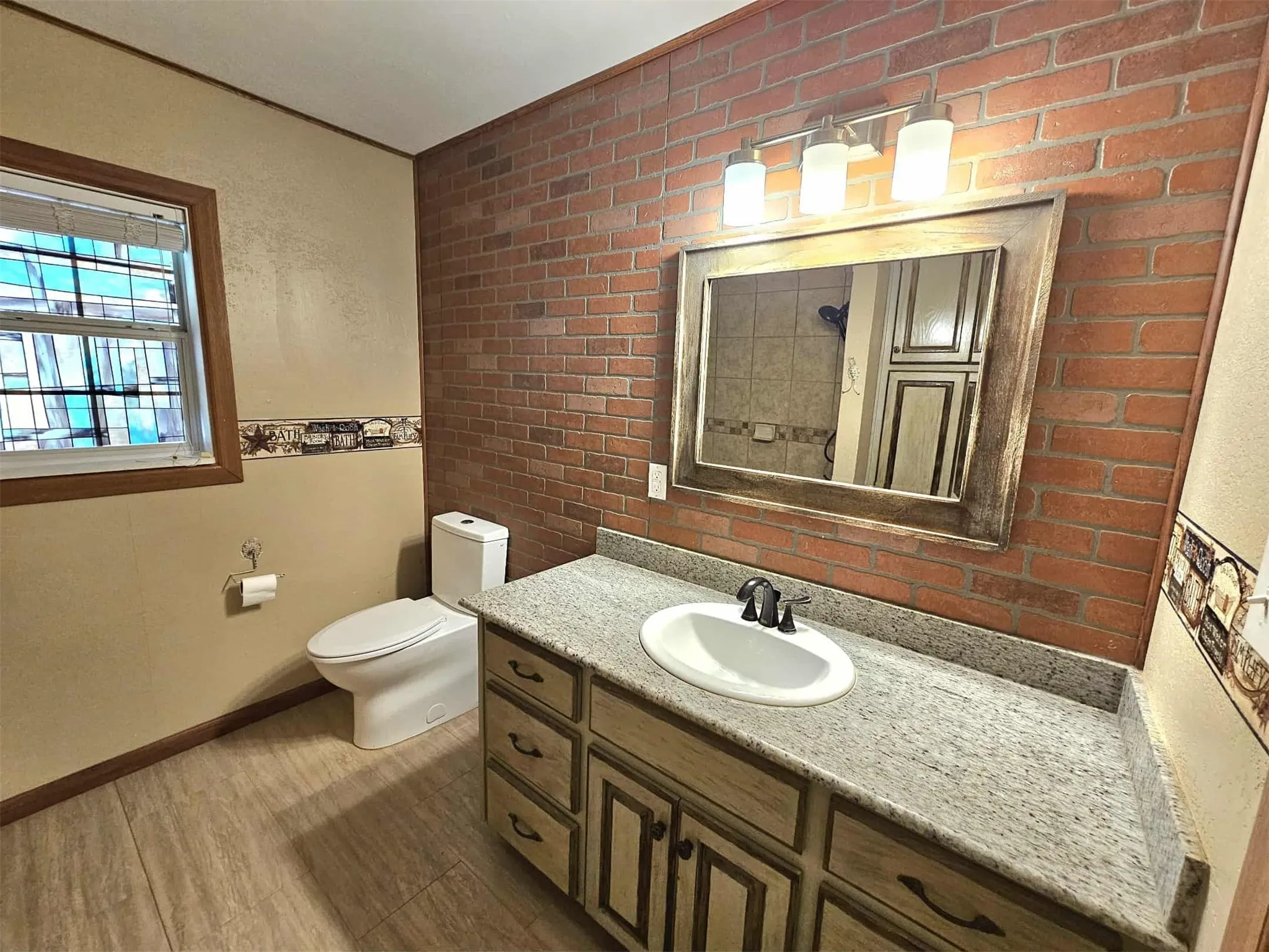 Bathroom featuring vanity and light wood-style flooring