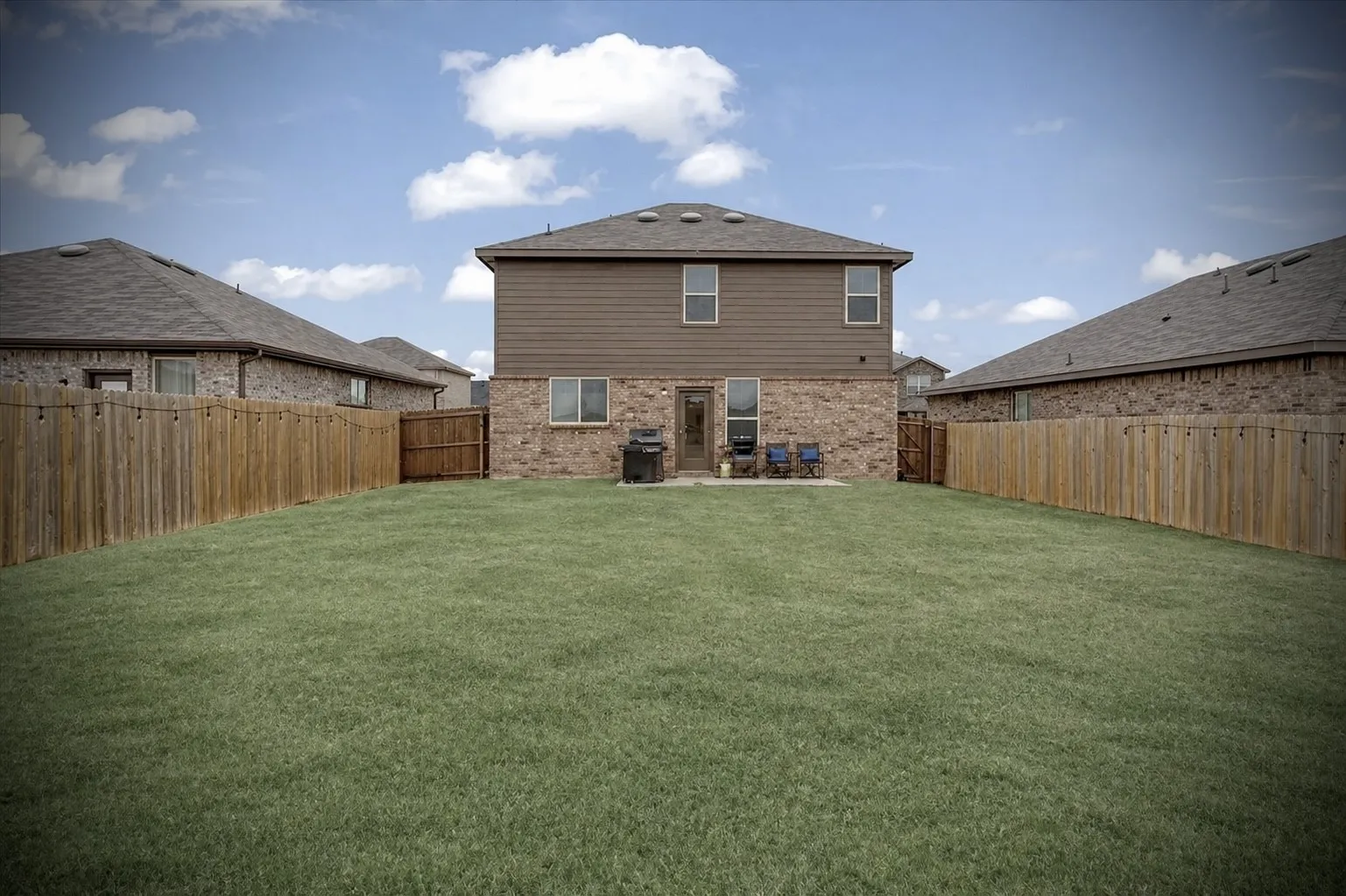 A covered porch and fire pit area would look so good here