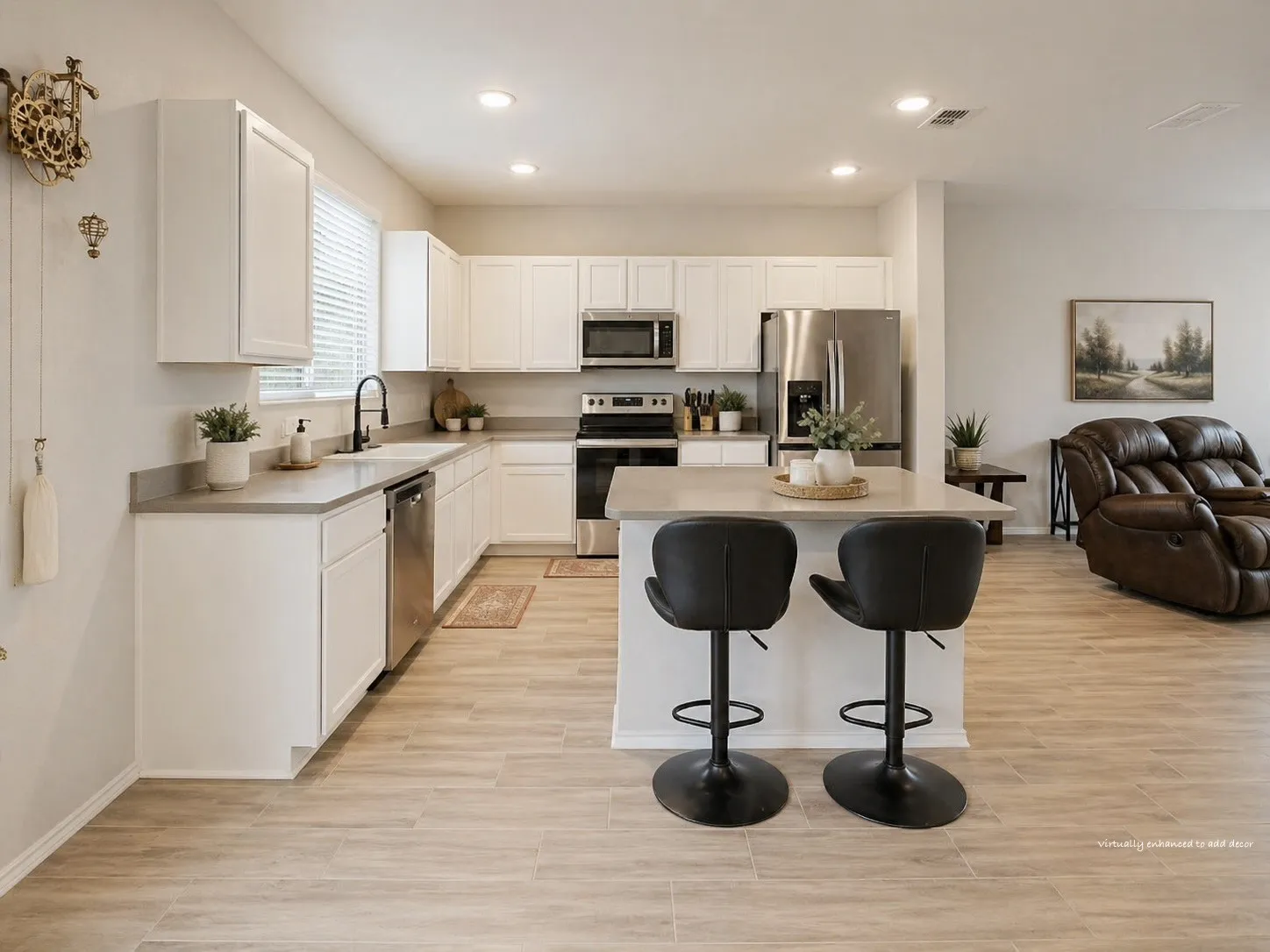 Nice and open space in the kitchen with a lot of counter space. Upgraded counter tops and a breakfast bar.