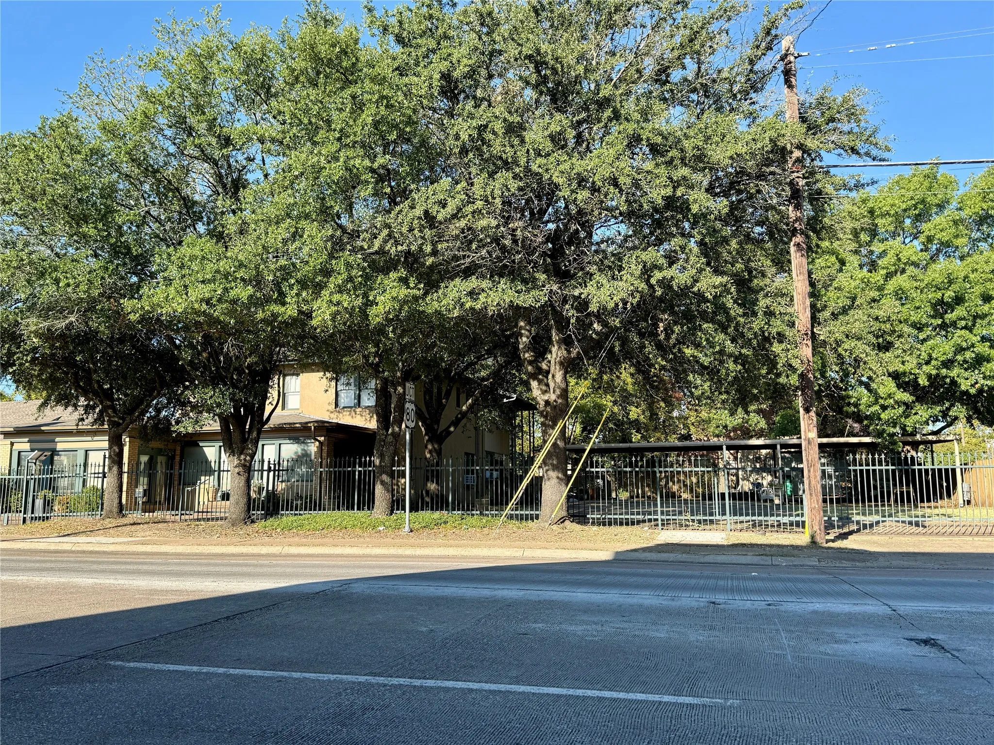 View of concrete road with curbs